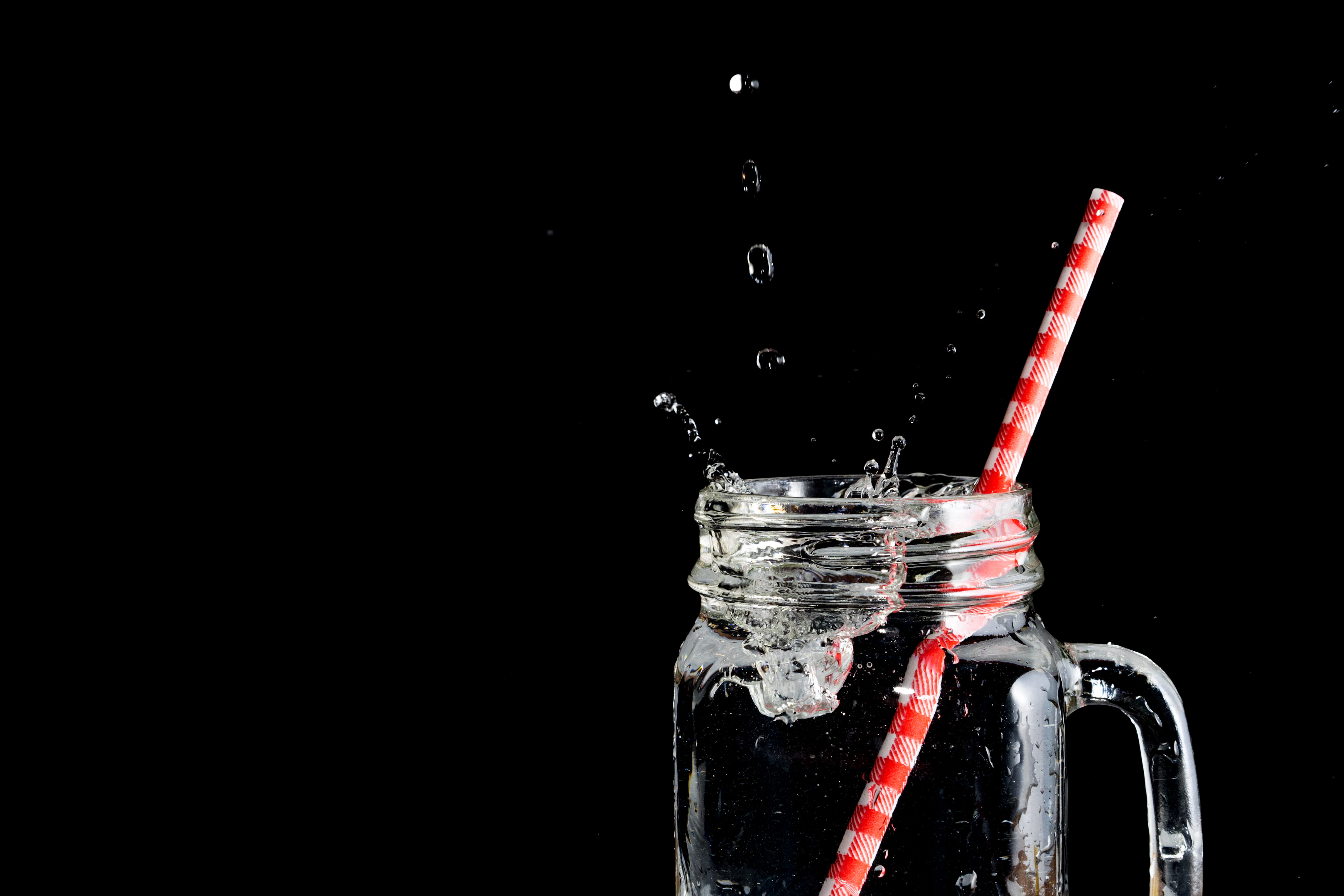 splashing, refreshment, splatted, no people, close-up, drinking straw, water, dark, ice, studio shot, red, jar, black background, drinking, mason, indoors, HD Wallpaper