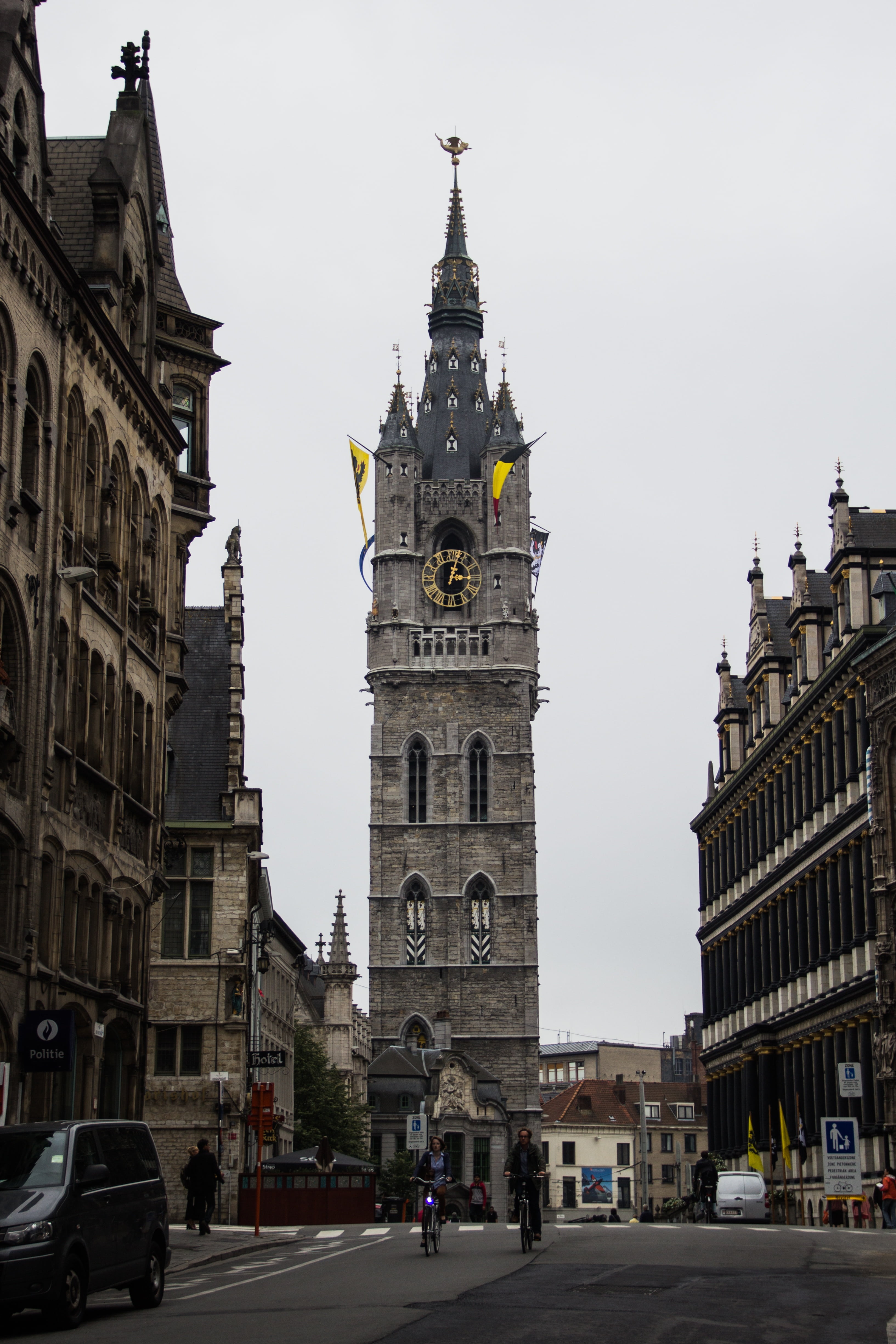flags, church tower, car, city, outdoors, sky, belgium, clock, building, tower, travel destinations, place of worship, mode of transportation, belfry tower, Phone HD Wallpaper