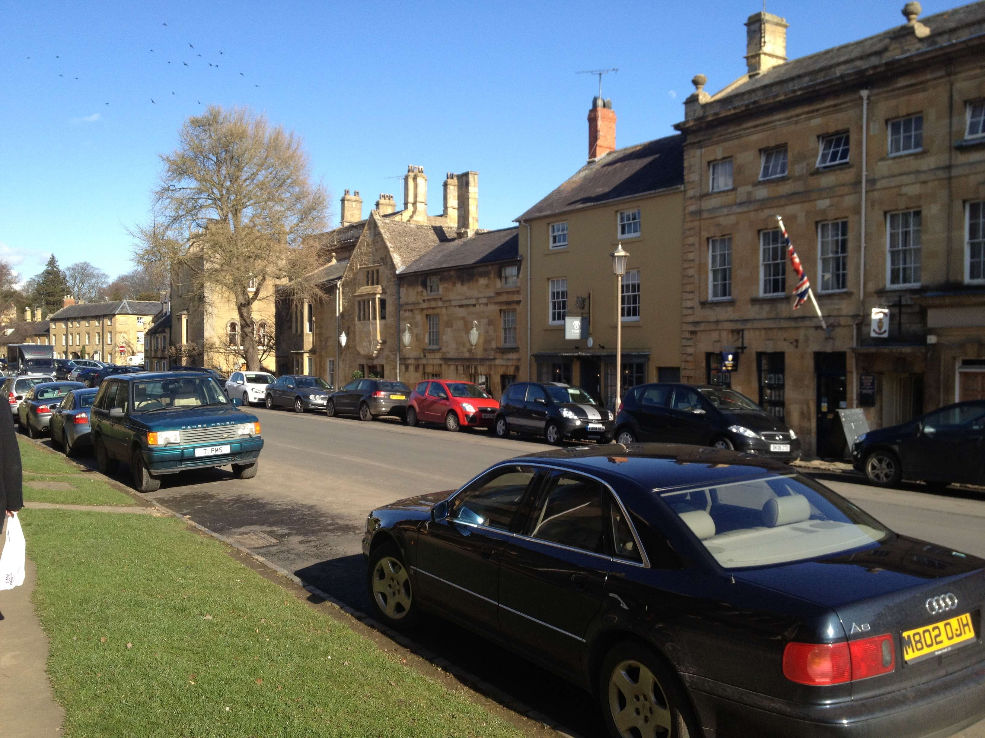 road, car, building, sunlight, cotswolds, sky, incidental people, stationary, nature, motor vehicle, land vehicle, city, building exterior, day, street, HD Wallpaper