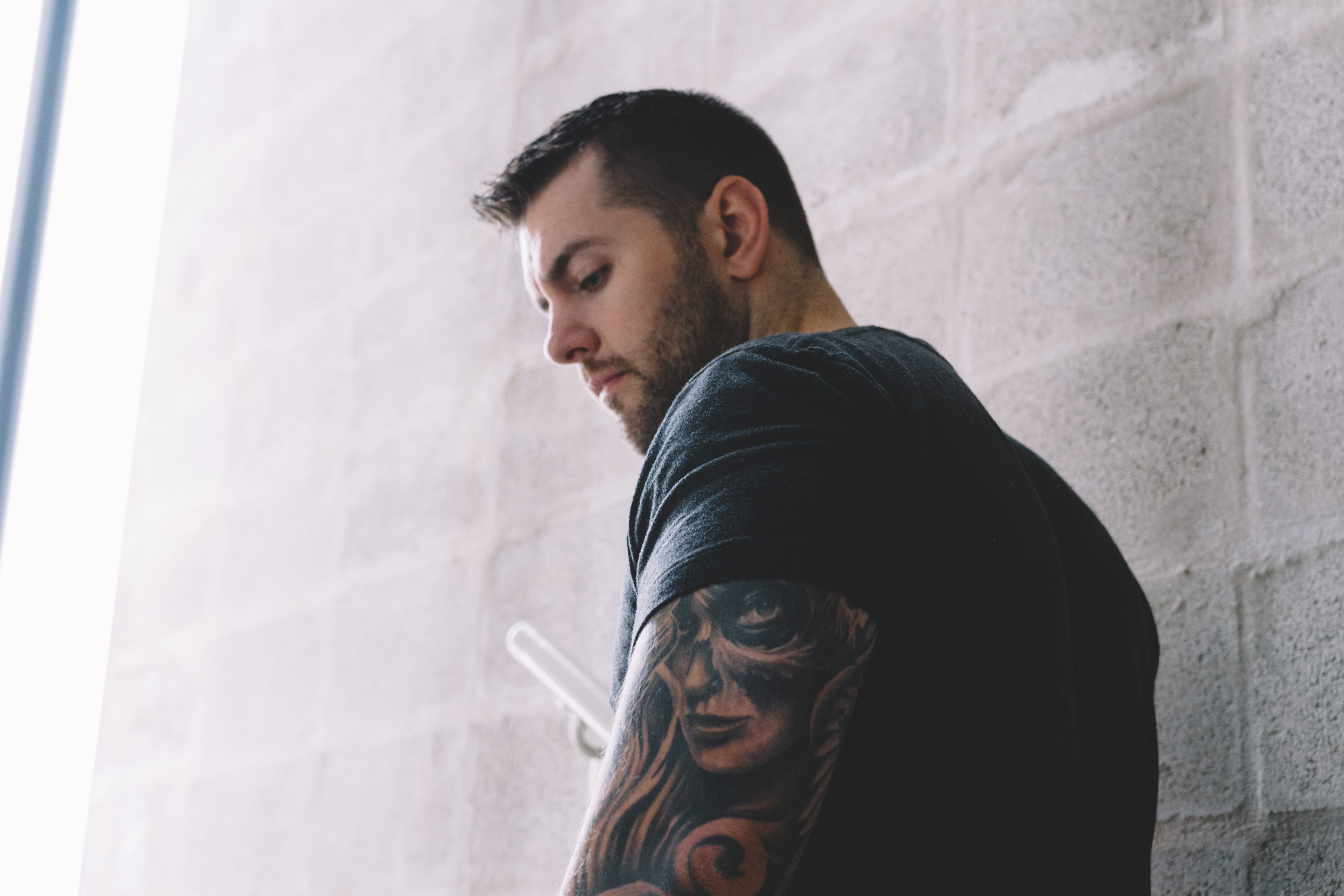 real people, casual clothing, lifestyles, low angle view, arm, suit, shirt, apparel, beard, architecture, overcoat, t, 5K, tattoo, young men, portrait, HD Wallpaper