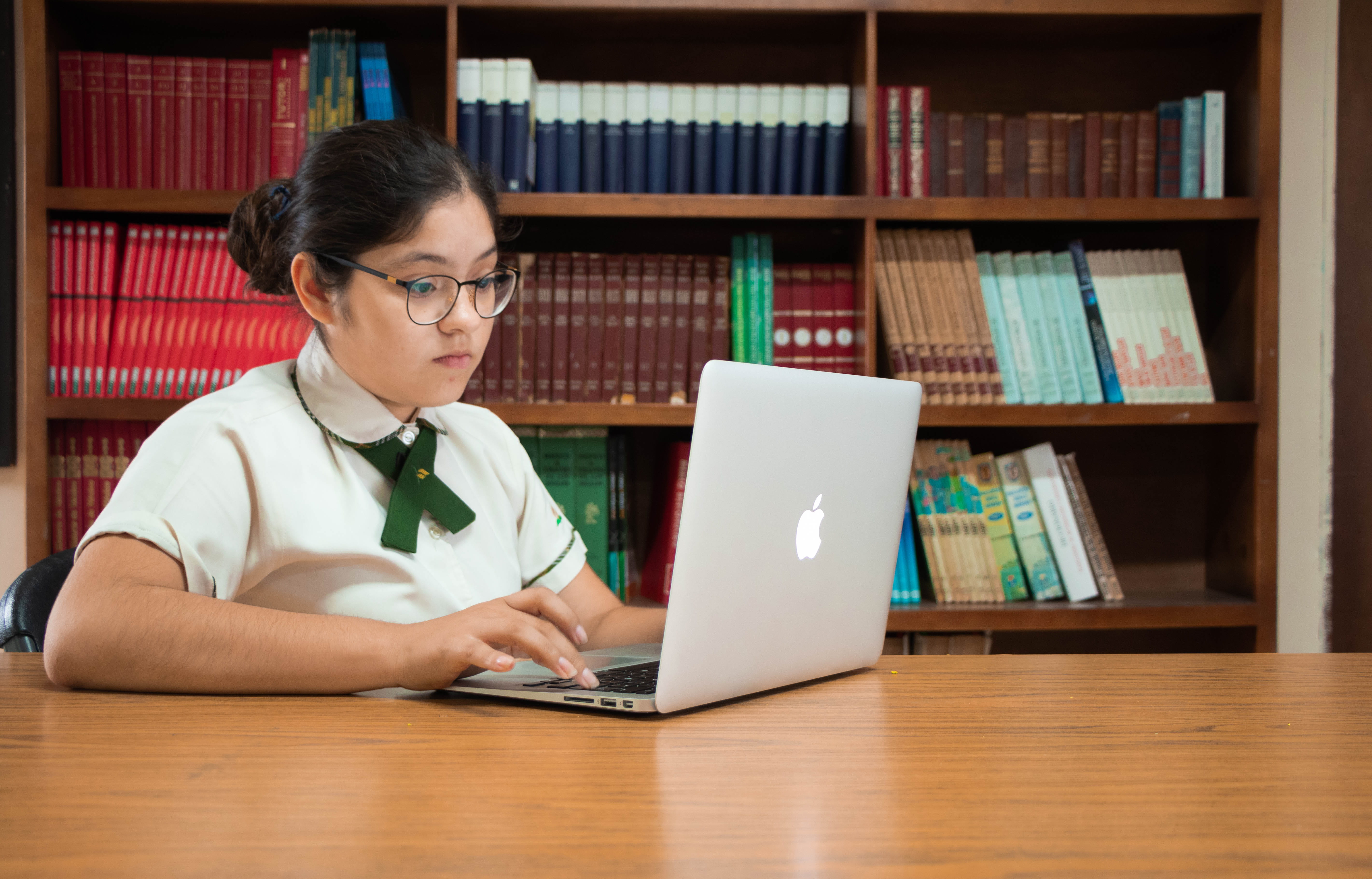 sitting, desk, eyeglasses, communication, accessories, education, one person, table, room, using laptop, human, shelf, 5K, person, computer, electronics, HD Wallpaper