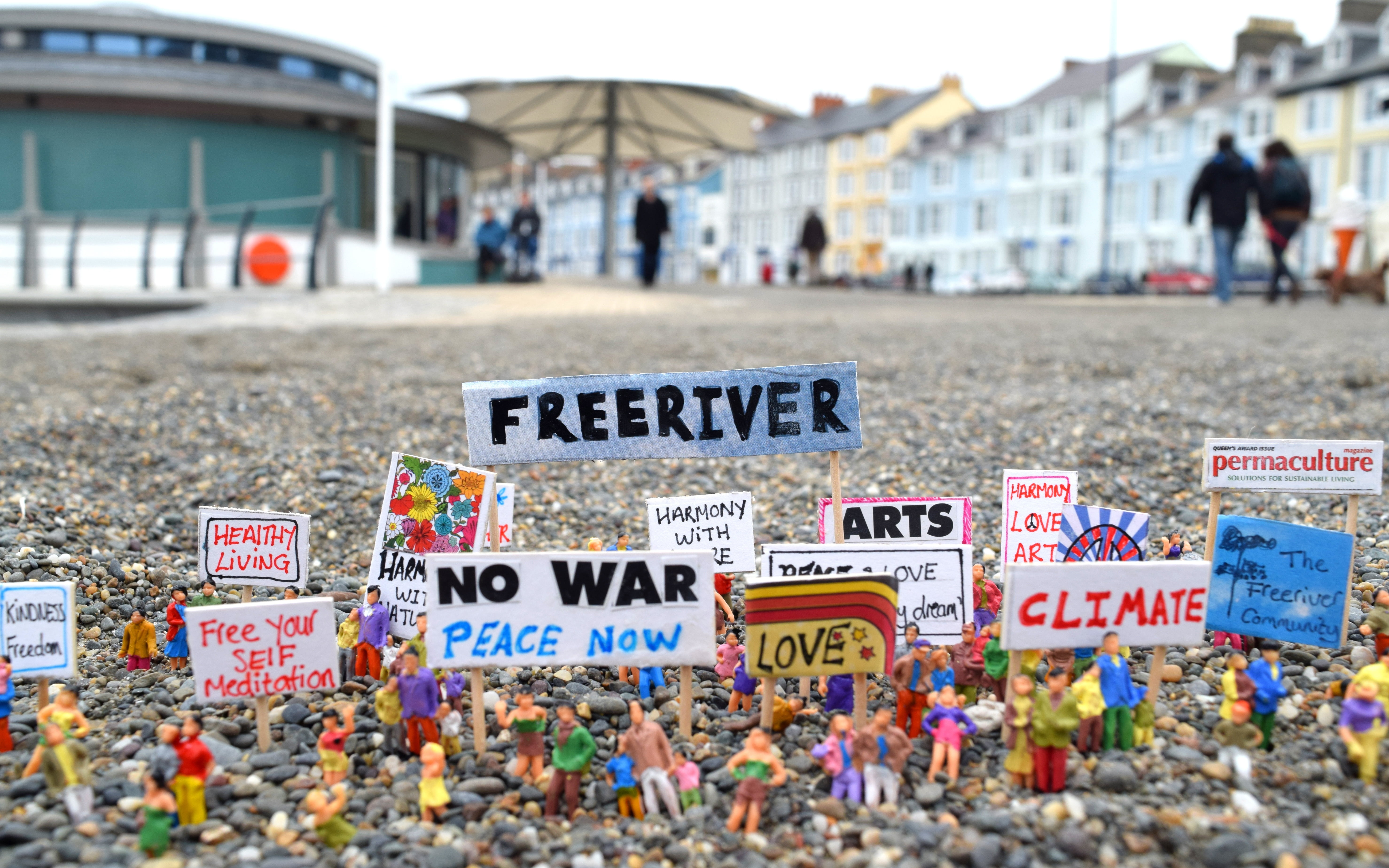 street, information, lifestyle, joanna bond, figure, give peace a chance, little people, artist, models, built structure, modern art, text, day, anti-war, HD Wallpaper