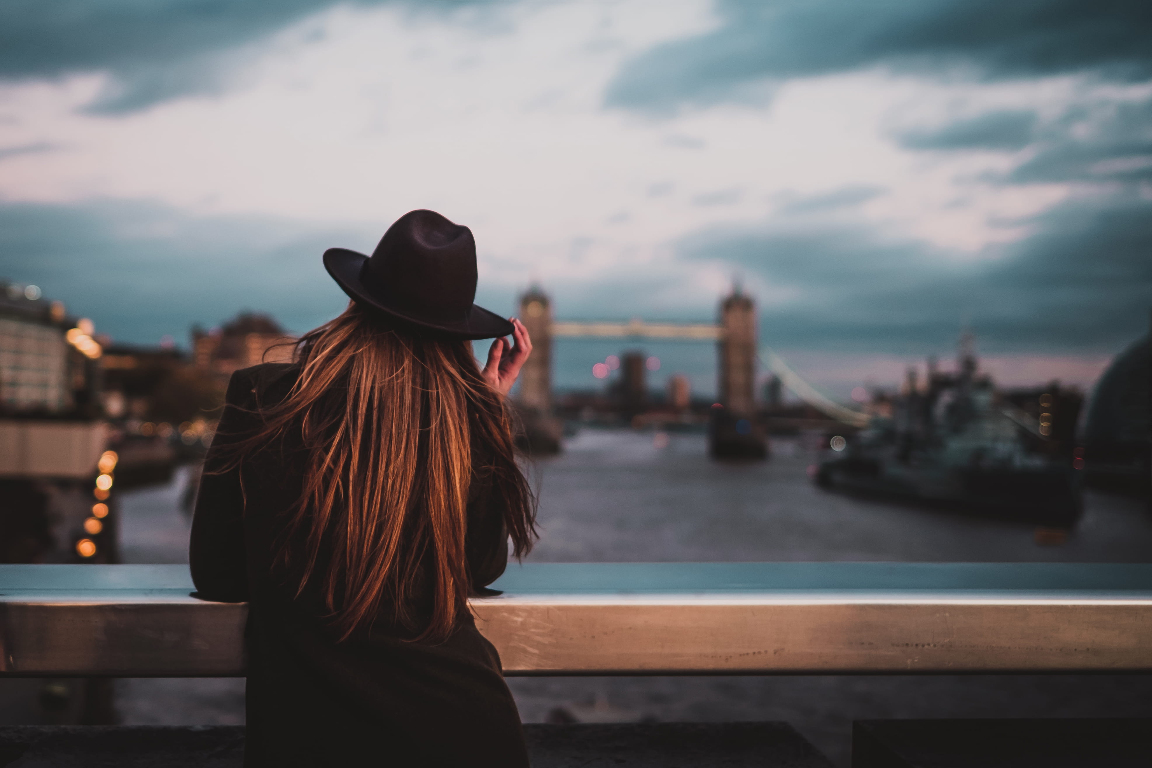adult, bridge, sky, focus, water, woman, looking at view, hair, looking, fedora, female, 4K, black, portrait, photo, tower, hat, railings, real people, HD Wallpaper