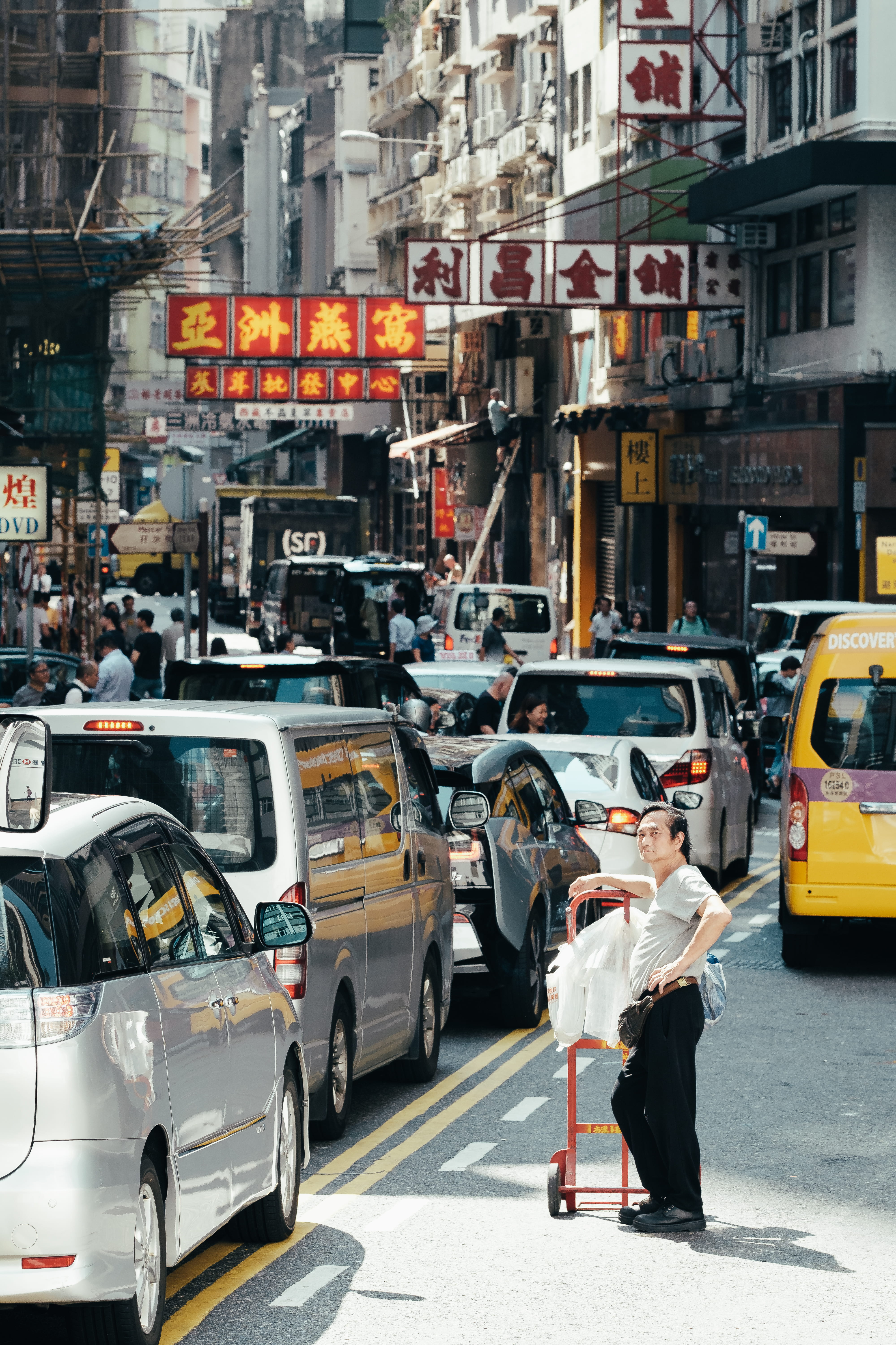 city, sign, traffic, car, scaffolding, city street, pedestrian, commute, street, day, vehicle, man, built structure, person, busy, urban, taxi, mode of transportation, Phone HD Wallpaper