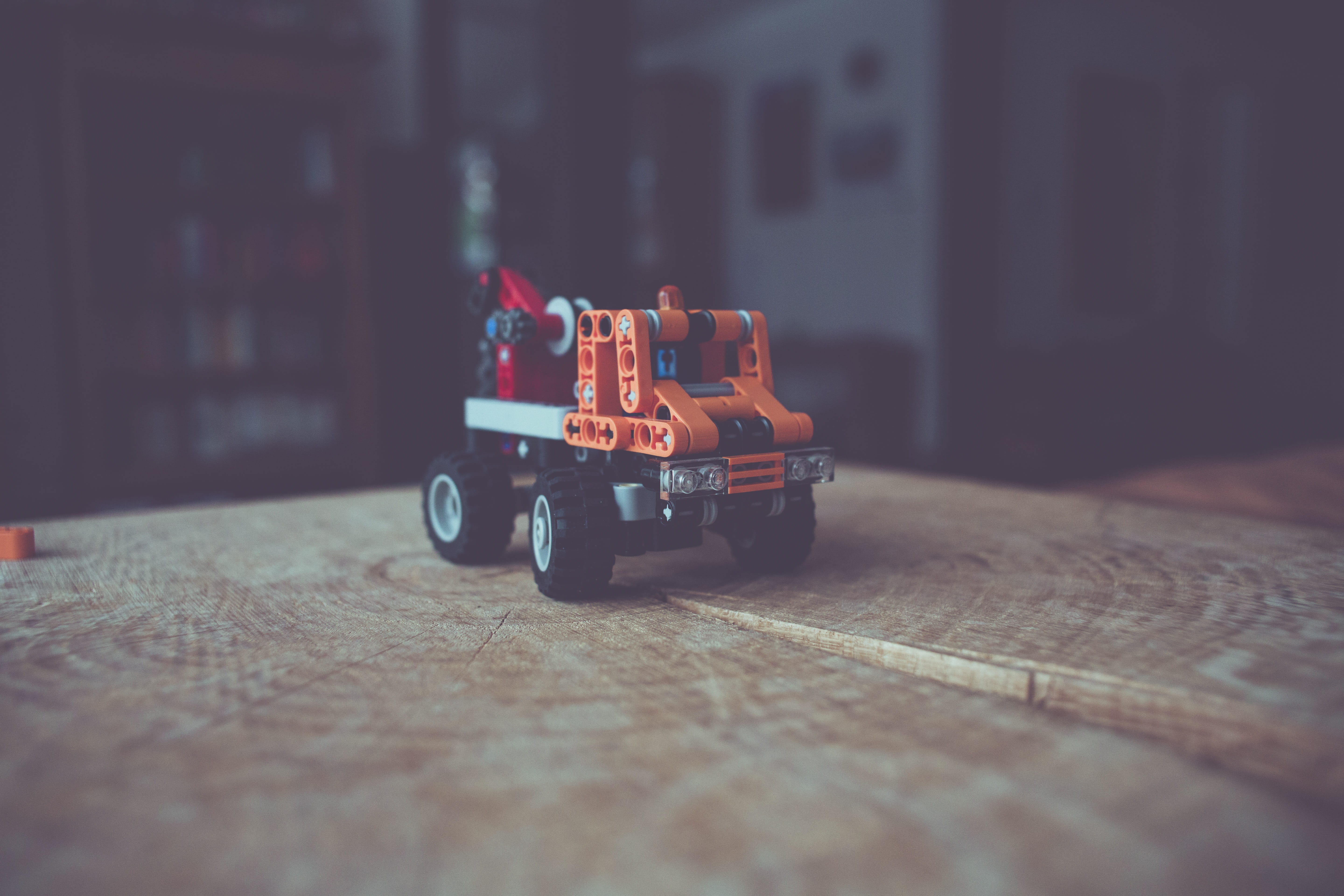 colorful, truck, indoors, childrens room, tow truck, toy, table, selective focus, 5K, lego stones, construction toys, still life, architecture, toy car, HD Wallpaper