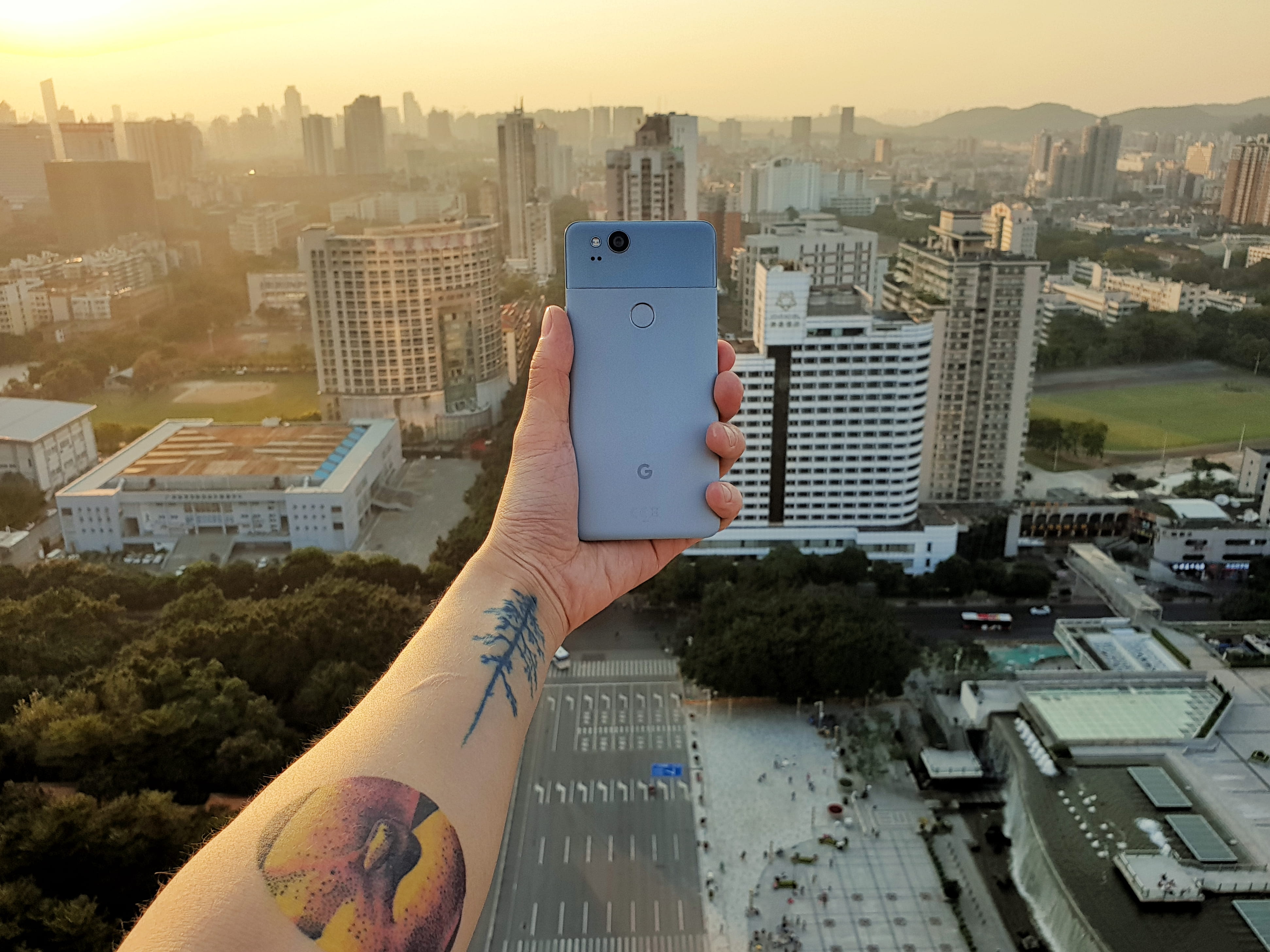 one person, tattoo, outdoors, showing, building, china, building exterior, holding, day, personal perspective, human body part, rise, town, phone, high, HD Wallpaper
