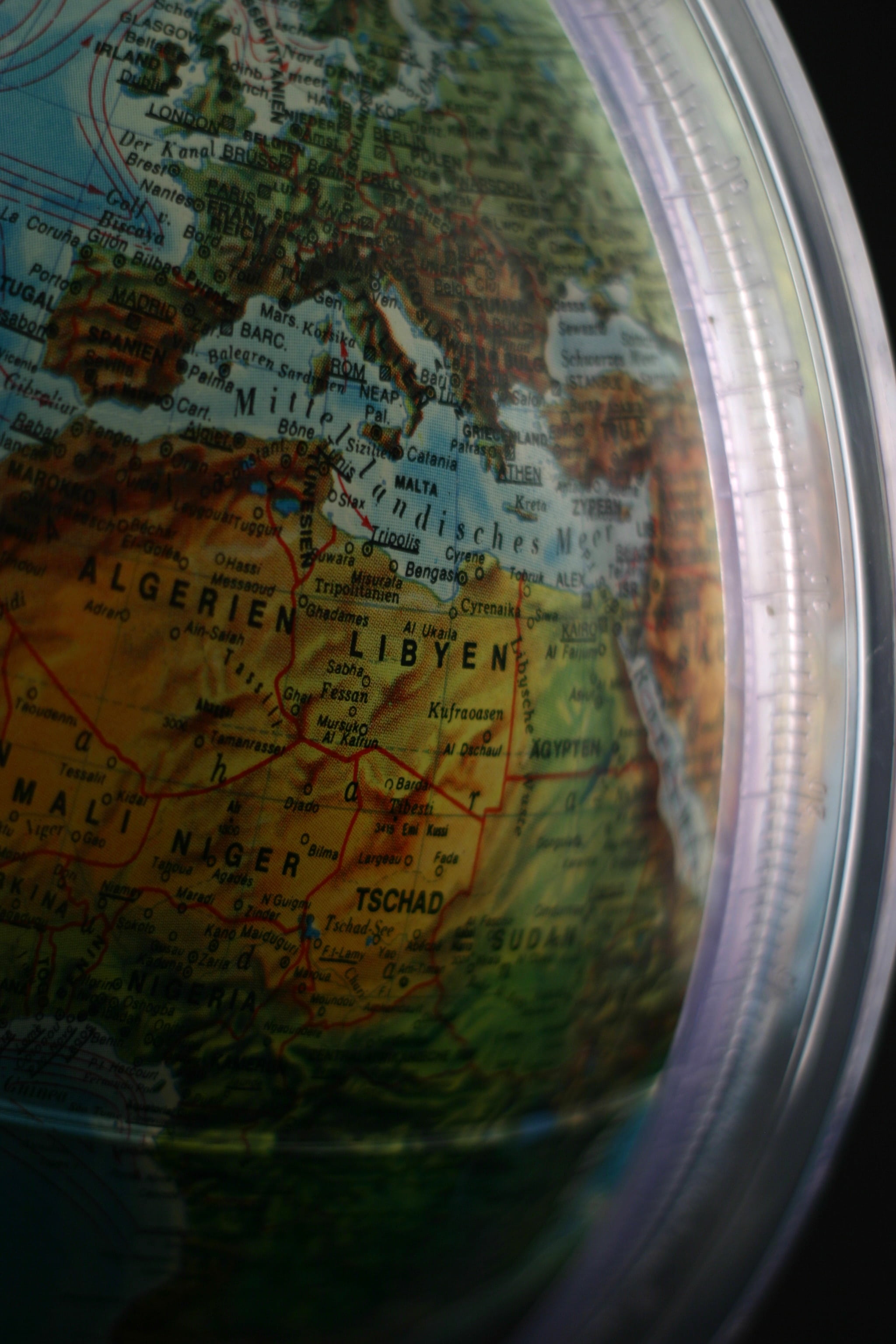 communication, indoors, no people, close-up, direction, western script, map, planet earth, 2K, selective focus, text, glass - material, travel, world map, Phone HD Wallpaper