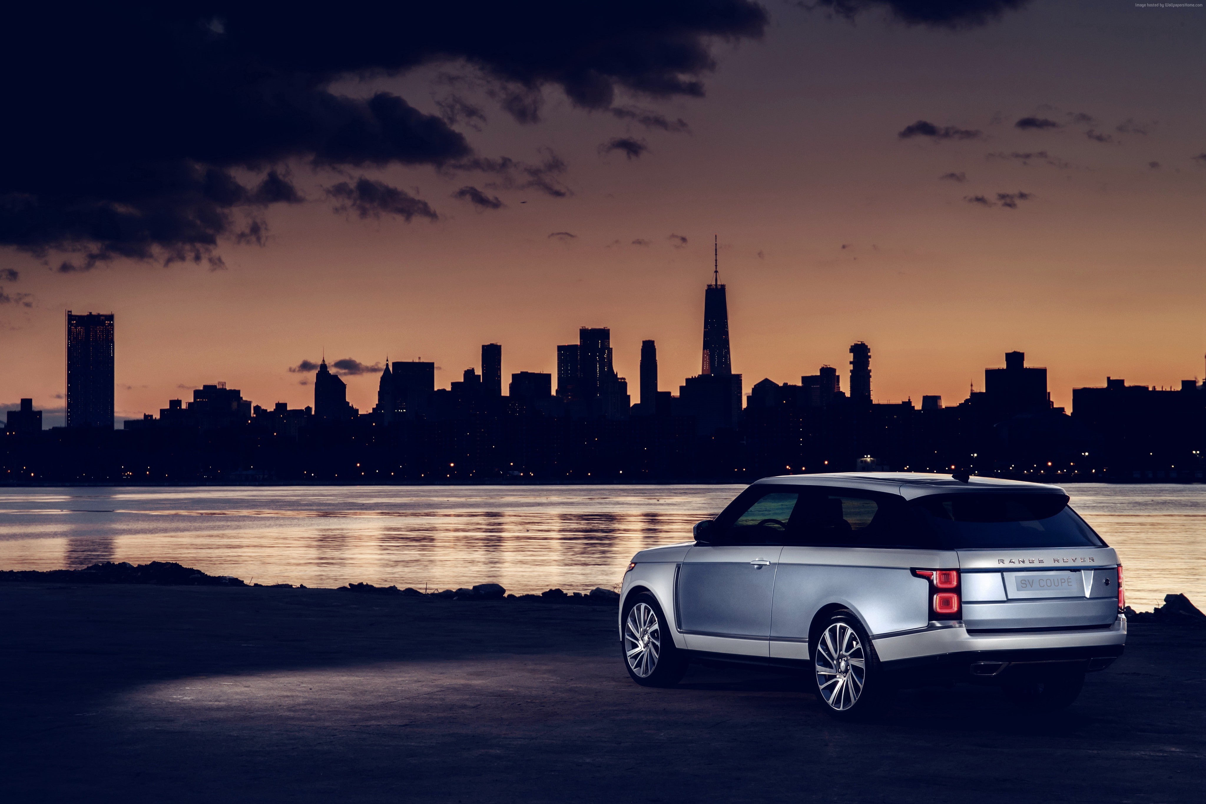 car, transportation, Land Rover Range Rover SV Coupe, motor vehicle, city, tall - high, urban skyline, cloud - sky, skyscraper, 4K, building, building exterior, HD Wallpaper