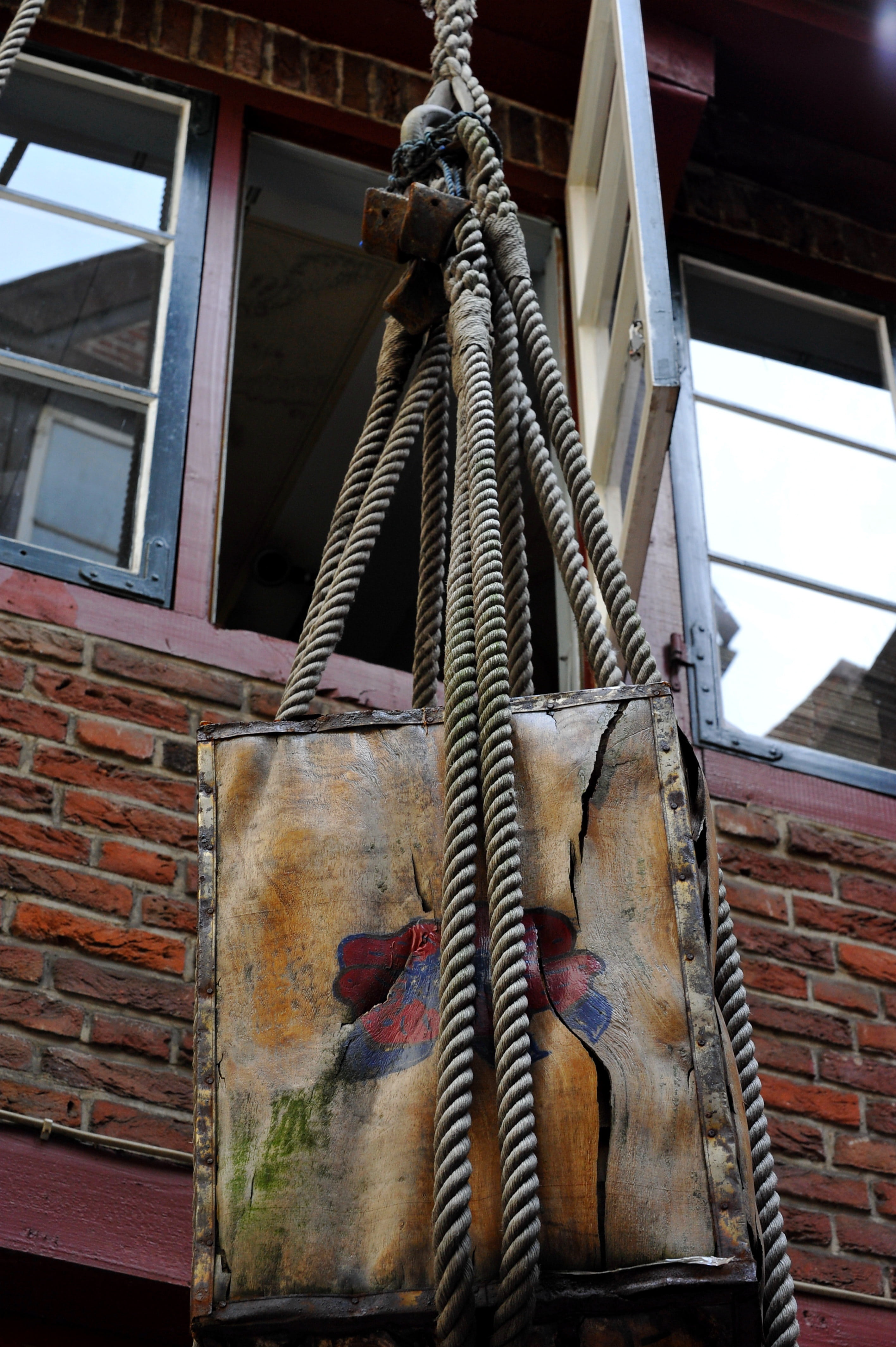 pulley, wall, tourist attraction, outdoors, hanging, rope, strength, low angle view, wall - building feature, brick wall, window, old, brick, metal, machinery, Phone HD Wallpaper