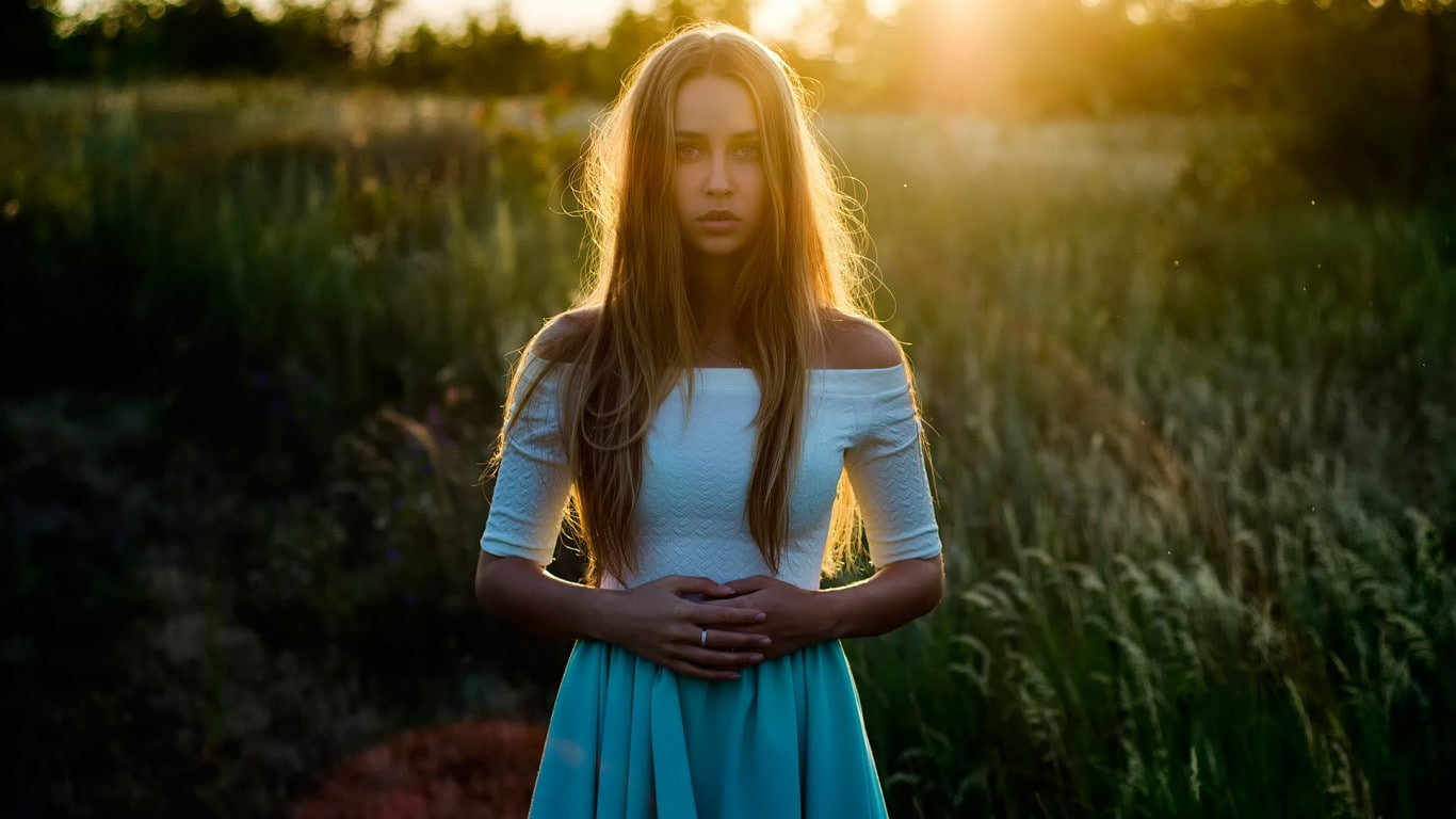 looking at camera, women outdoors, skirt, field, leisure activity, standing, sunlight, bare shoulders, women, fashion, sunset, white tops, lifestyles, portrait, HD Wallpaper