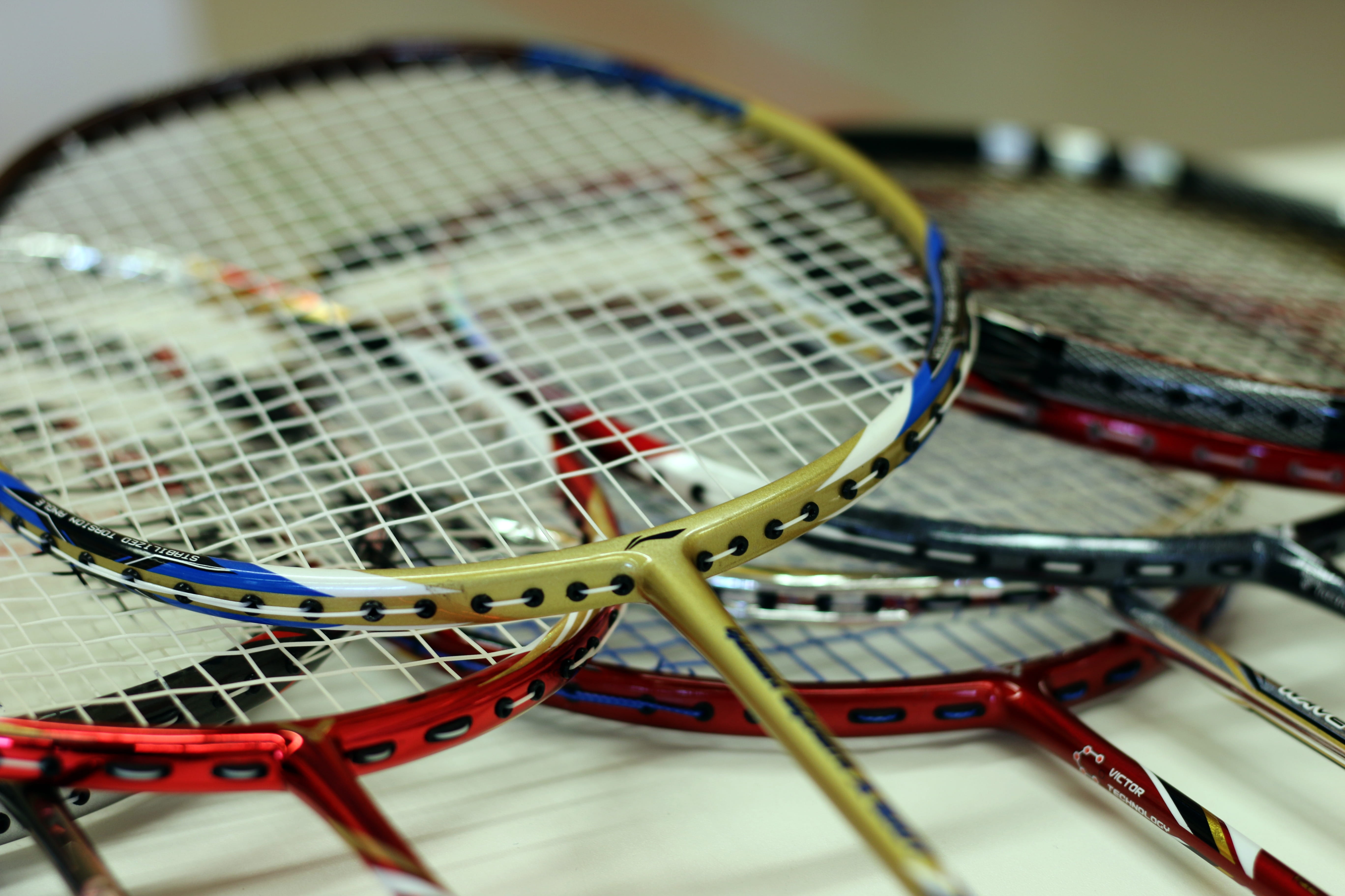 Racket, badminton racket, tennis, indoors, arts culture and entertainment, focus on foreground, still, no people, concerns, detail, movement, color, strings, HD Wallpaper