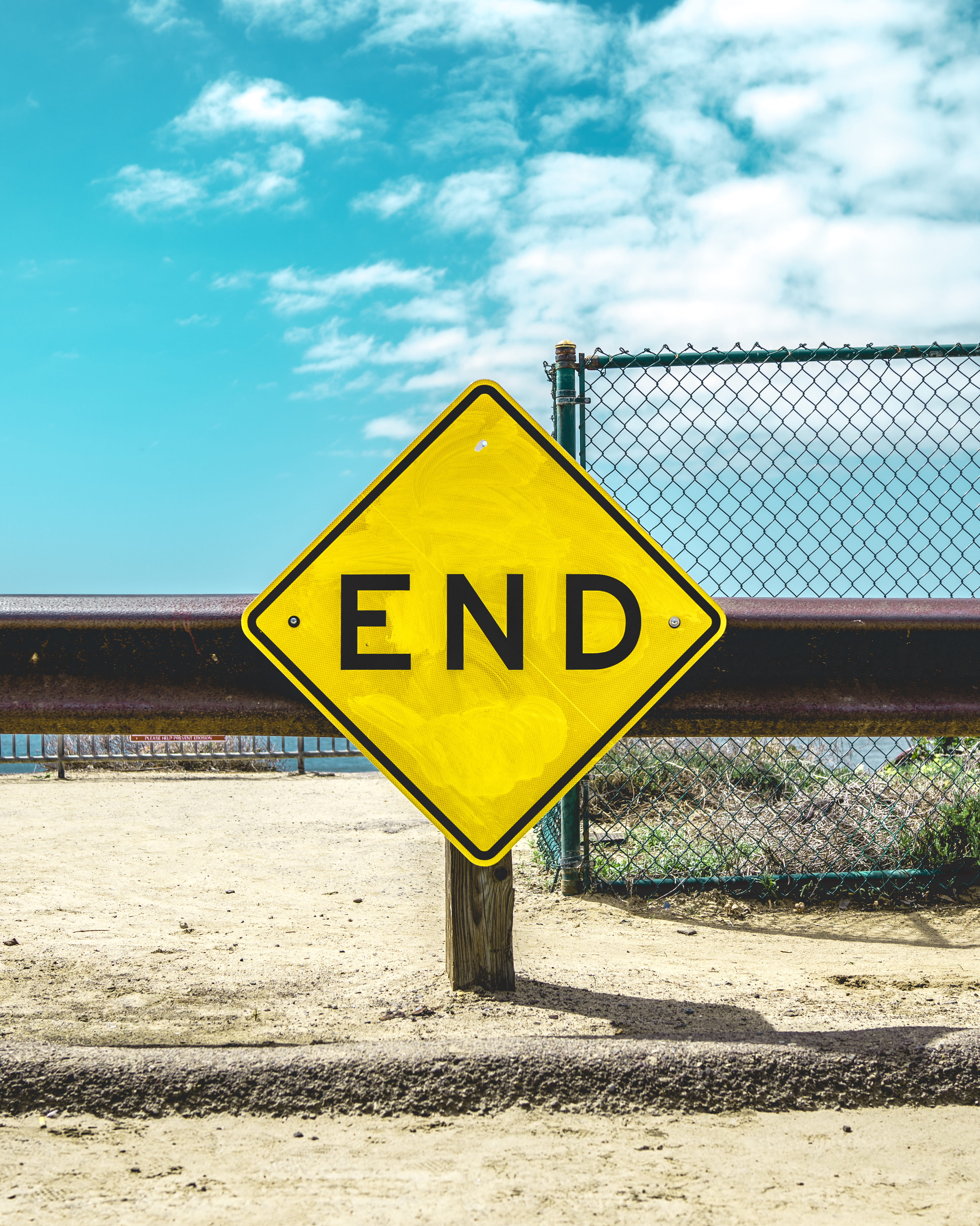warning sign, information sign, sign, sand, cloud - sky, fence, end, road, post, capital letter, safety, guidance, beach, sky, guardrail, signage, yellow, Phone HD Wallpaper