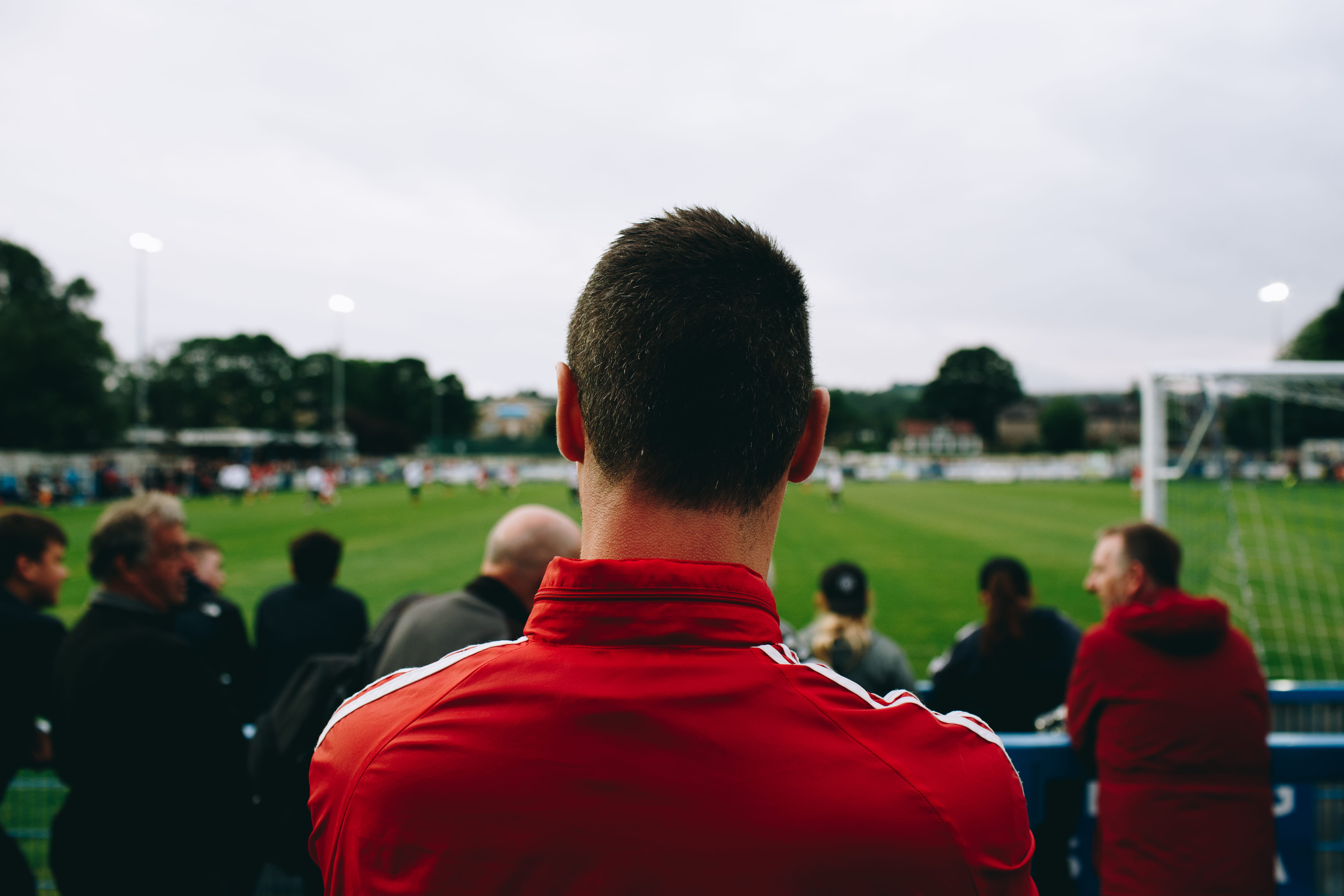day, focus on foreground, outdoors, watching, daytime, facing, crowd, nature, red, selective, field, photo, sports, spectator, lifestyles, group of people, HD Wallpaper