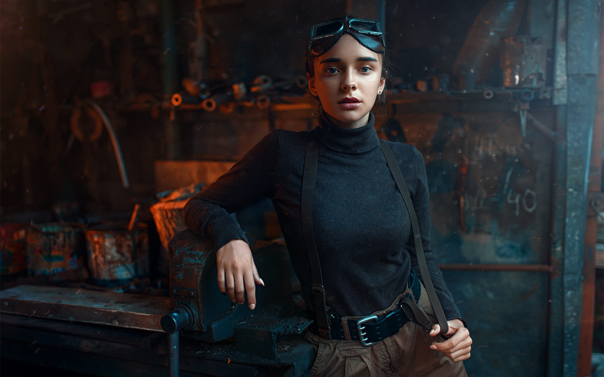 suspenders, model, women, black shirt, welding goggles, blue eyes, 1080P, brunette, belt, turtlenecks, looking at viewer, workshop, Maks Kuzin, portrait, HD Wallpaper