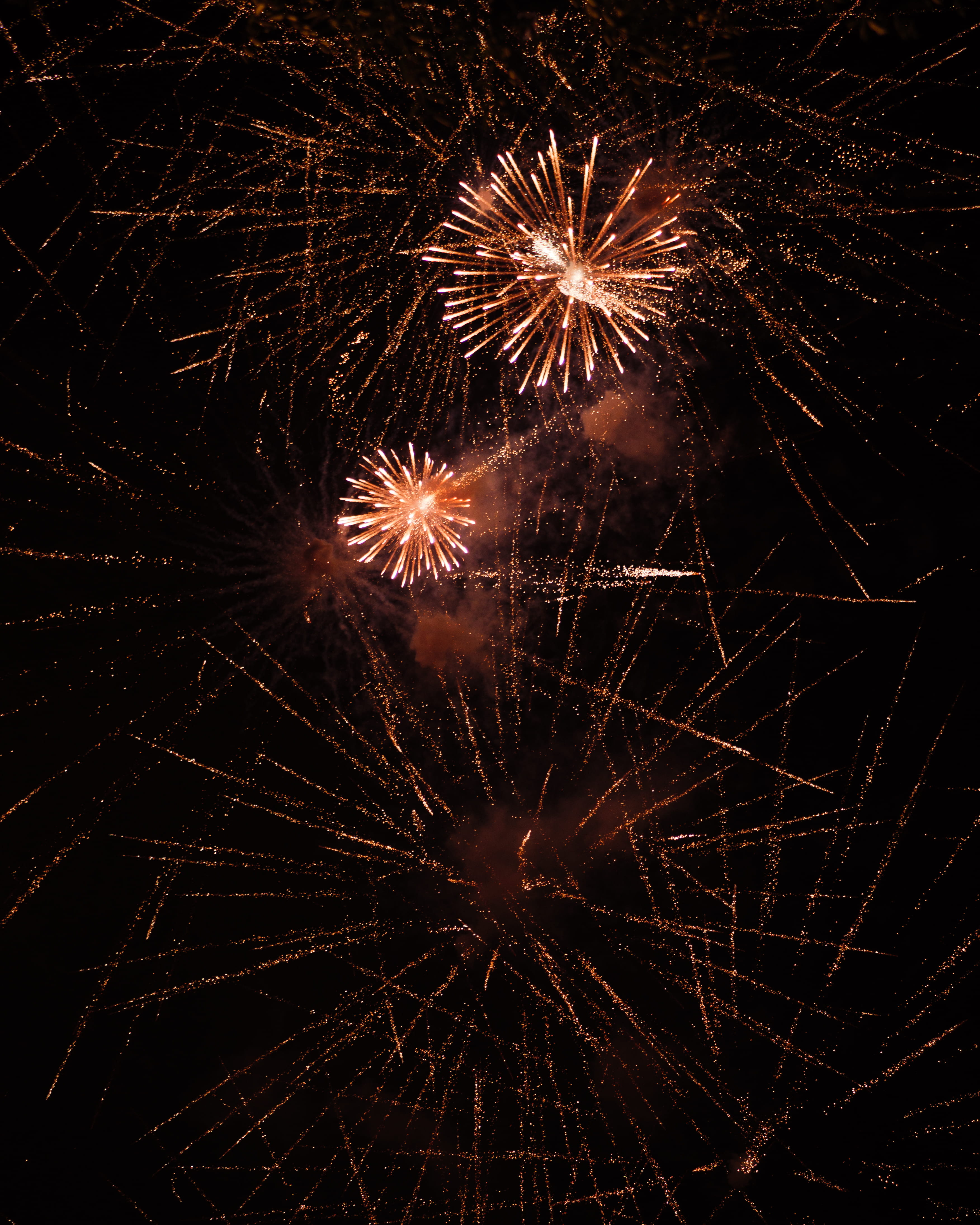 pattern, 4K, orange, night, radial, firework - Man Made Object, firework, black Color, background, fireworks, exploding, travel, light in the sky, Phone HD Wallpaper