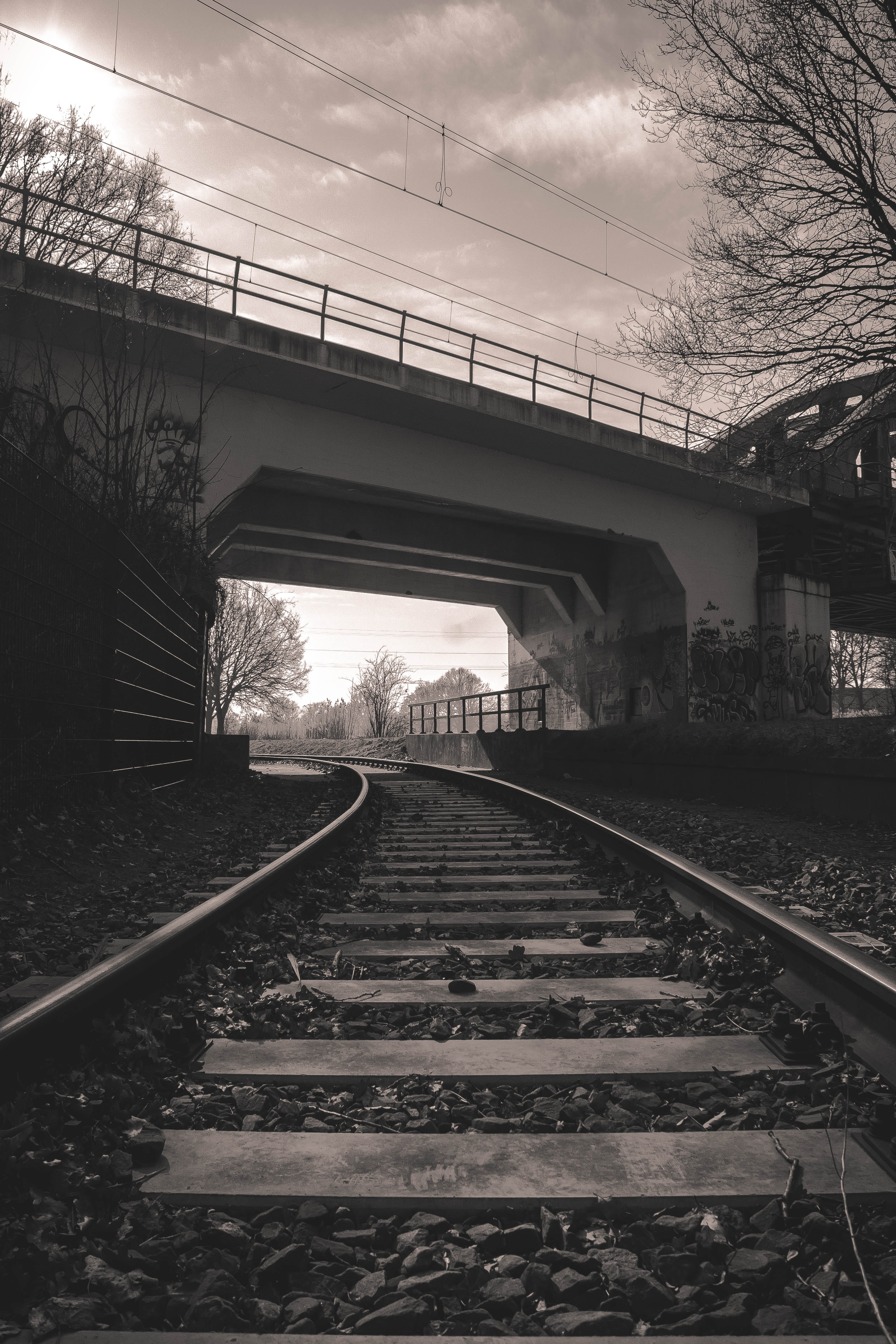 exploration, railway, direction, track, outdoors, parallel, tree, stone, no people, diminishing perspective, dark, long, bridge, bricks, gravel, wire, day, Phone HD Wallpaper
