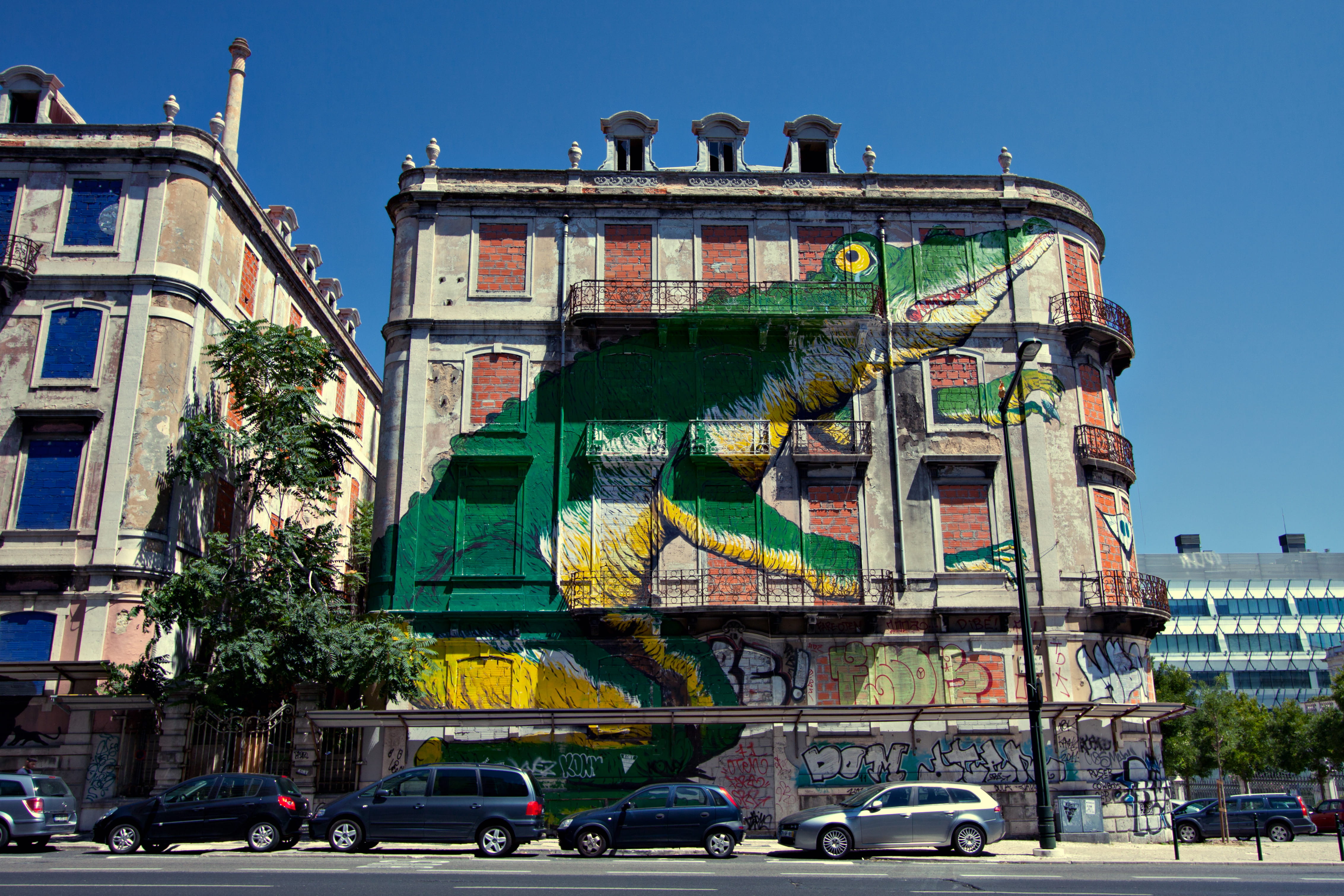 motor vehicle, road, travel Destinations, urban Scene, Lisbon, wall, transportation, land vehicle, DSLR, traffic, sky, captured, building, mural, Image, HD Wallpaper