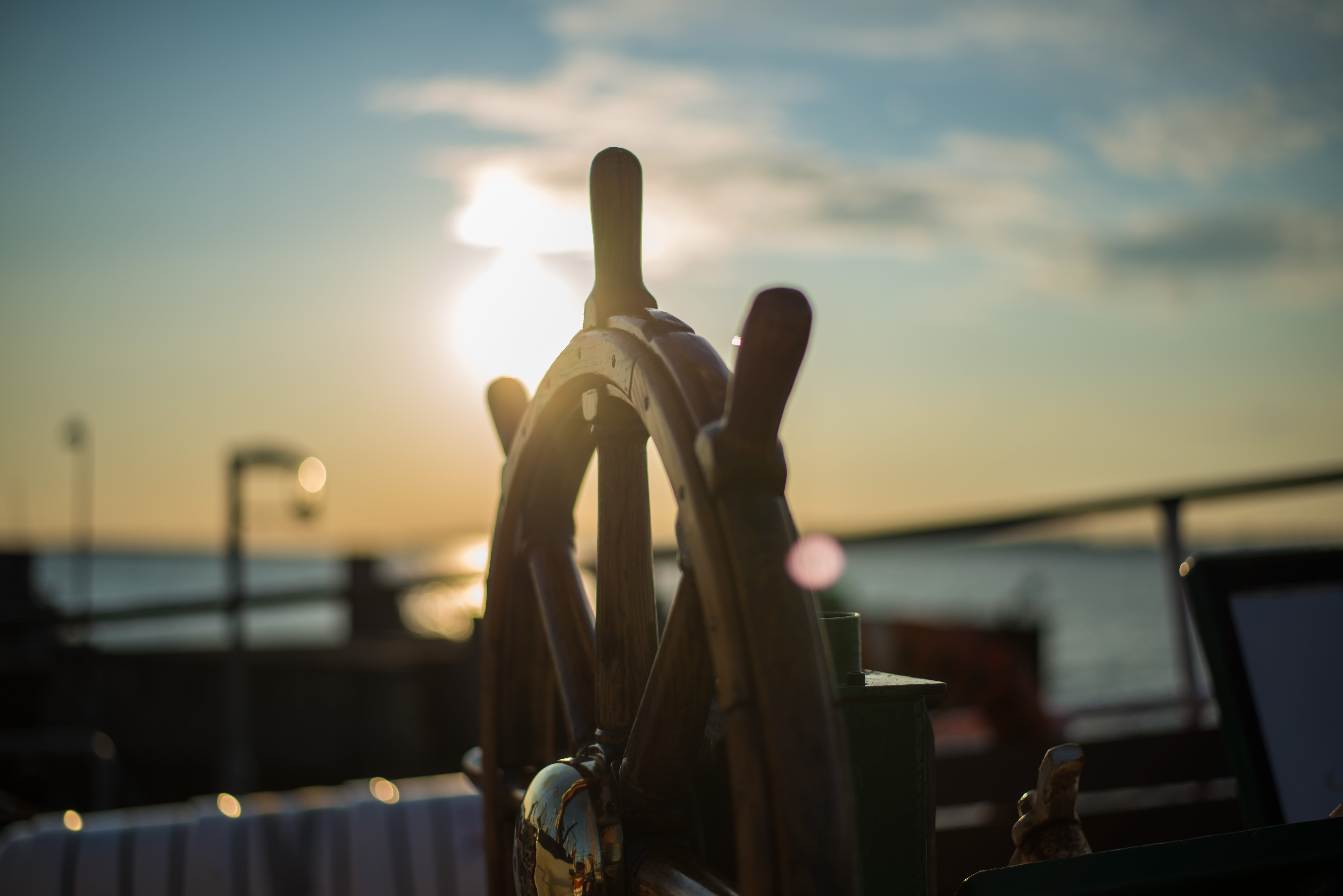 steering, railing, no people, still, travel, selective, light, outdoors, land vehicle, water, nature, bokeh, mode of transportation, close-up, photo, wooden, HD Wallpaper
