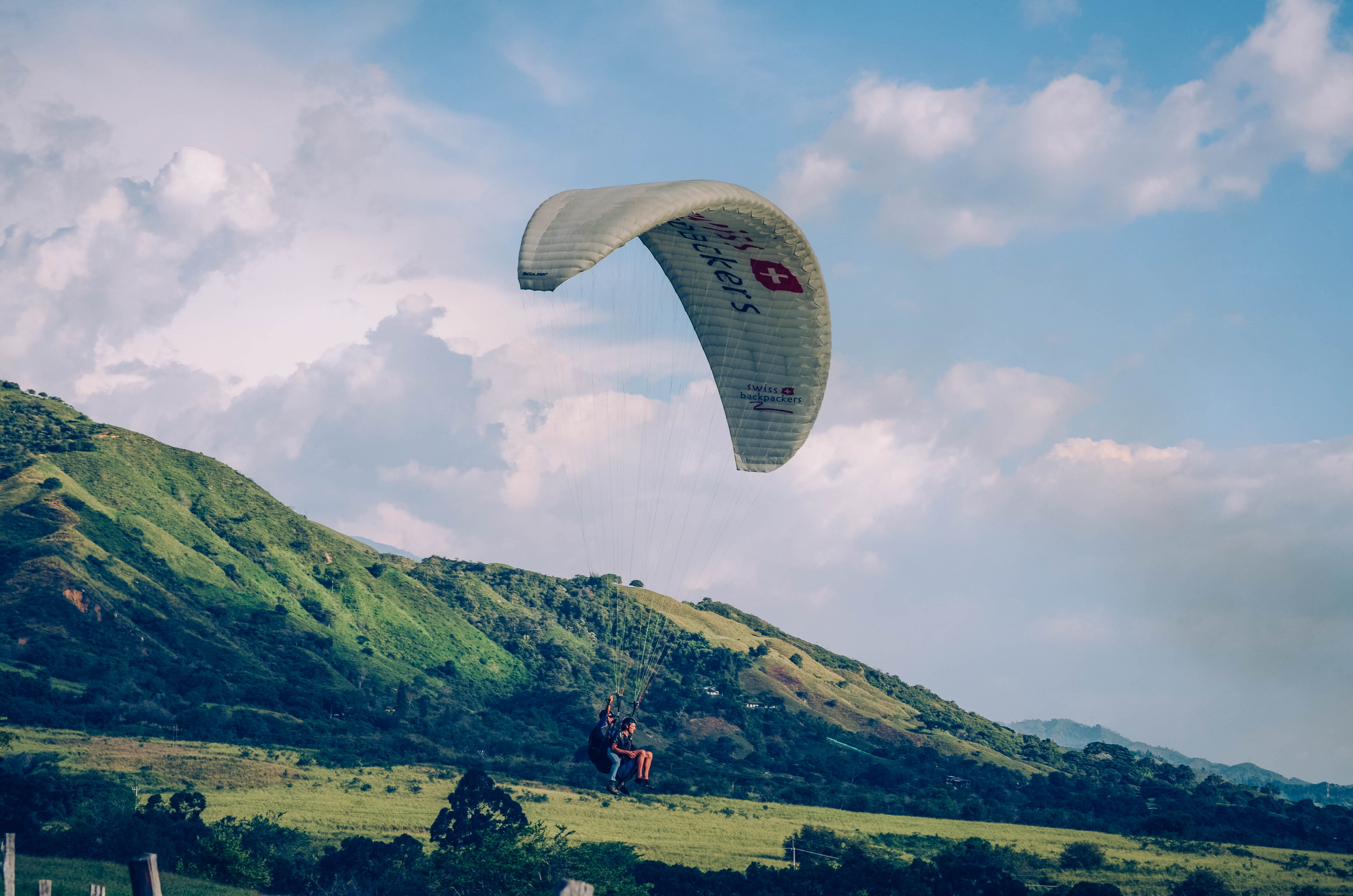 mid-air, sport, cloud - sky, person, leisure Activity, adventure, sky, beauty in nature, paraglider, extreme Sports, activity, real people, mountain, tranquil scene, HD Wallpaper