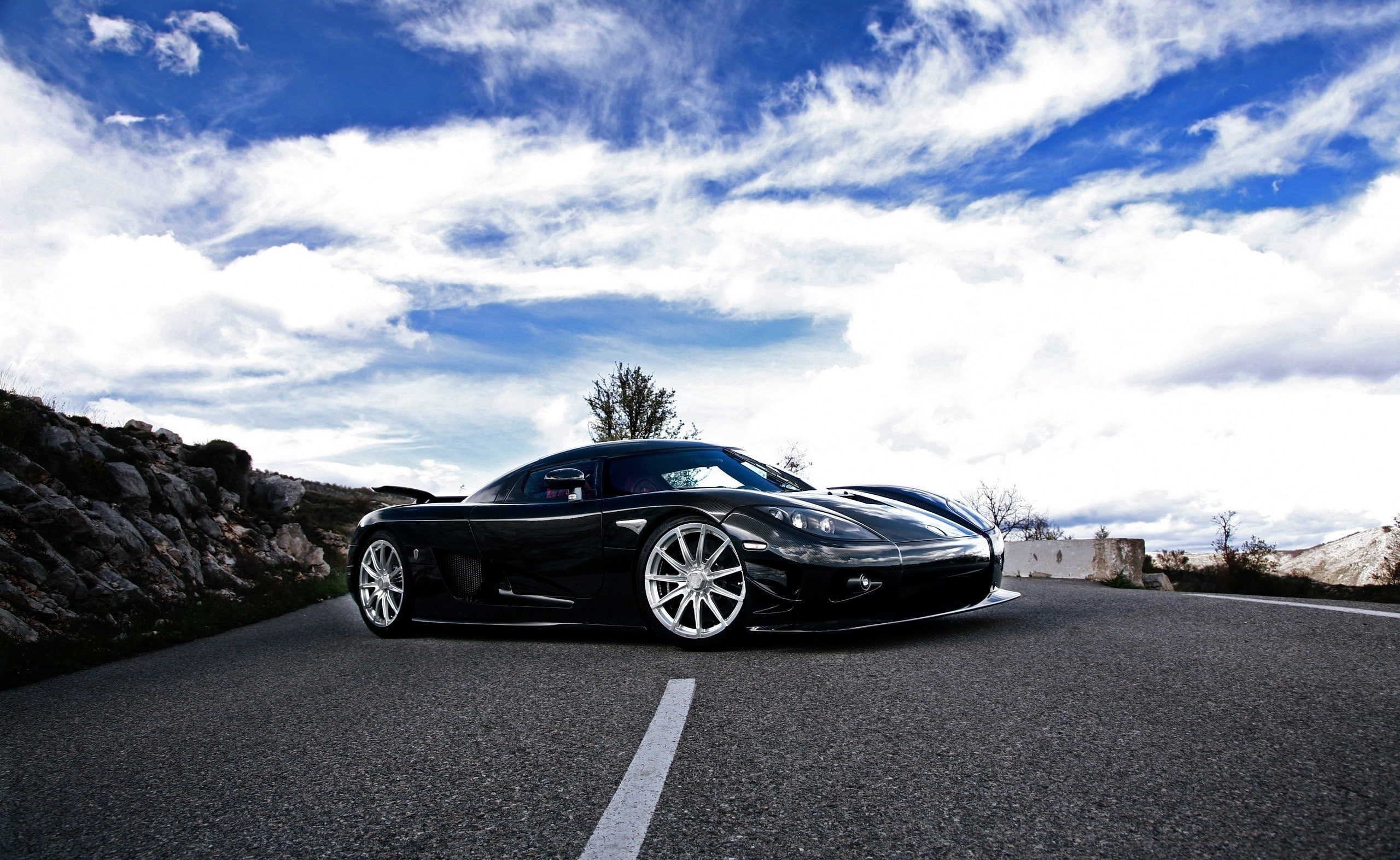 sign, street, road, land vehicle, CCXR, sky, stationary, day, black, Cars, transportation, nature, coupe, cloud - sky, car, no people, motor vehicle, Koenigsegg, HD Wallpaper