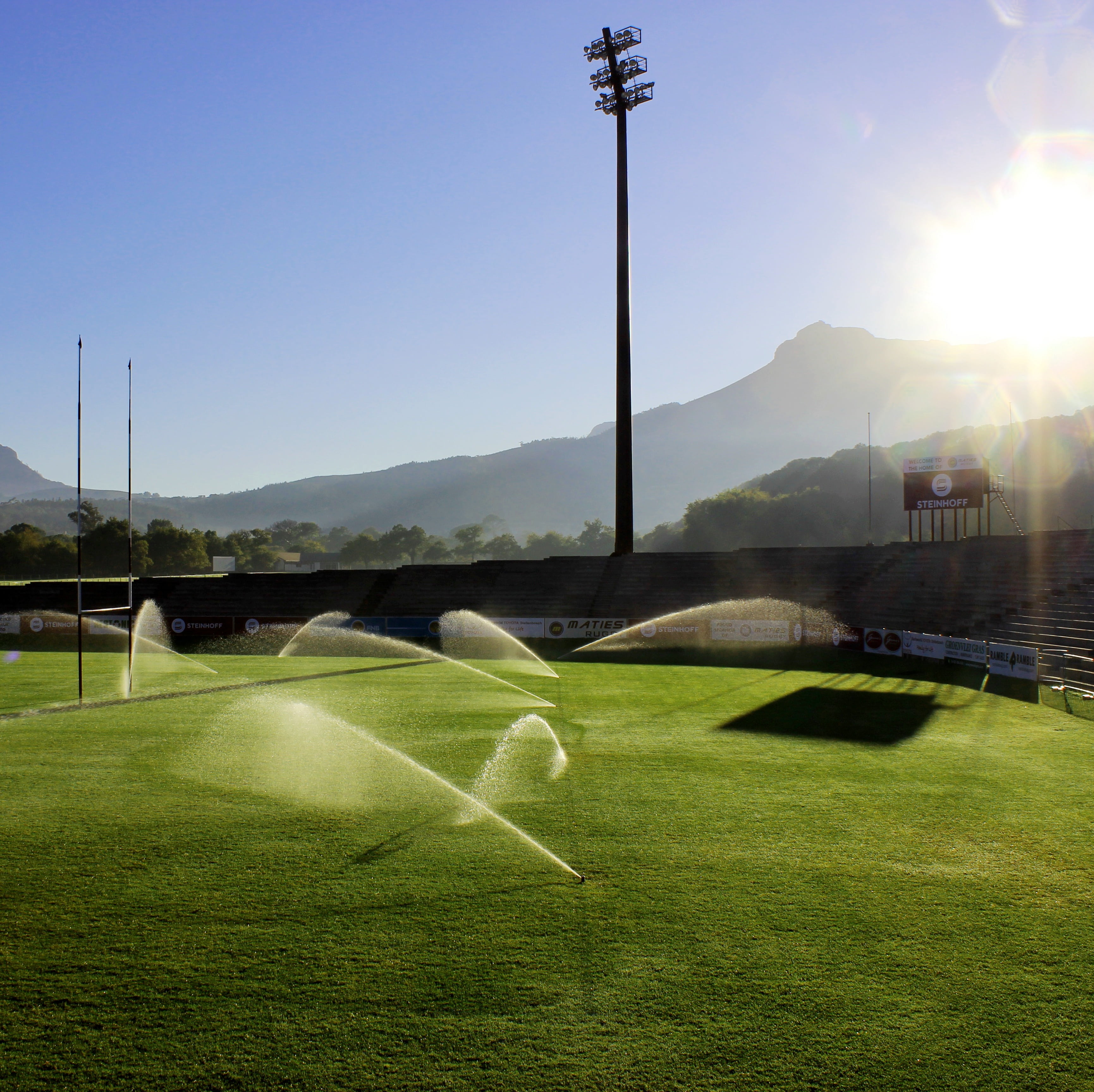 playing field, tranquility, open, photography, sprinklers, land, sport, ground, lens flare, sky, activity, plant, rugby, environment, sun, water, sunlight, HD Wallpaper
