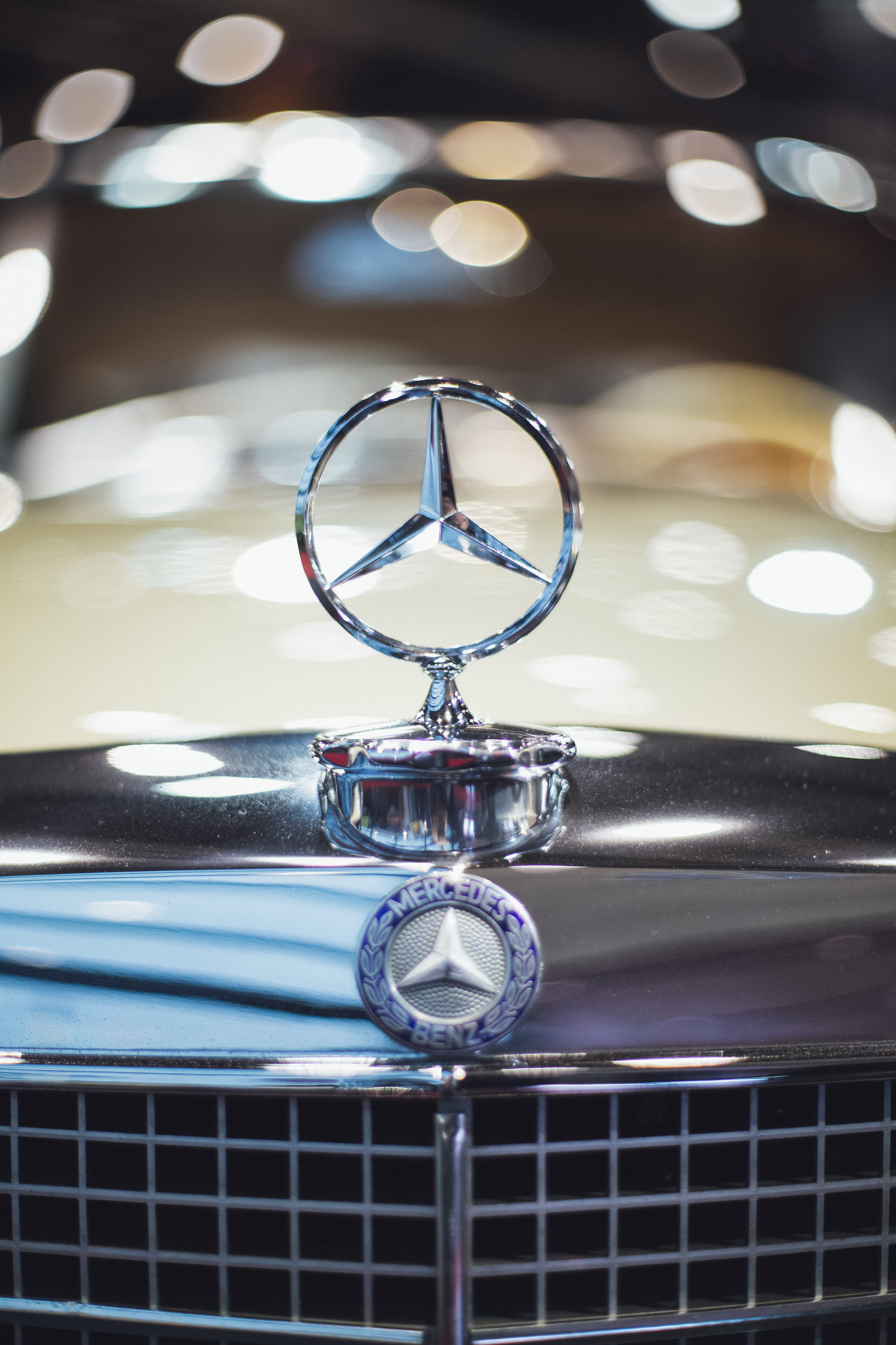 benz, macro, emblem, lighting equipment, pattern, focus on foreground, shiny, metal, land vehicle, mercedes, chrome, table, illuminated, day, retro styled, Phone HD Wallpaper