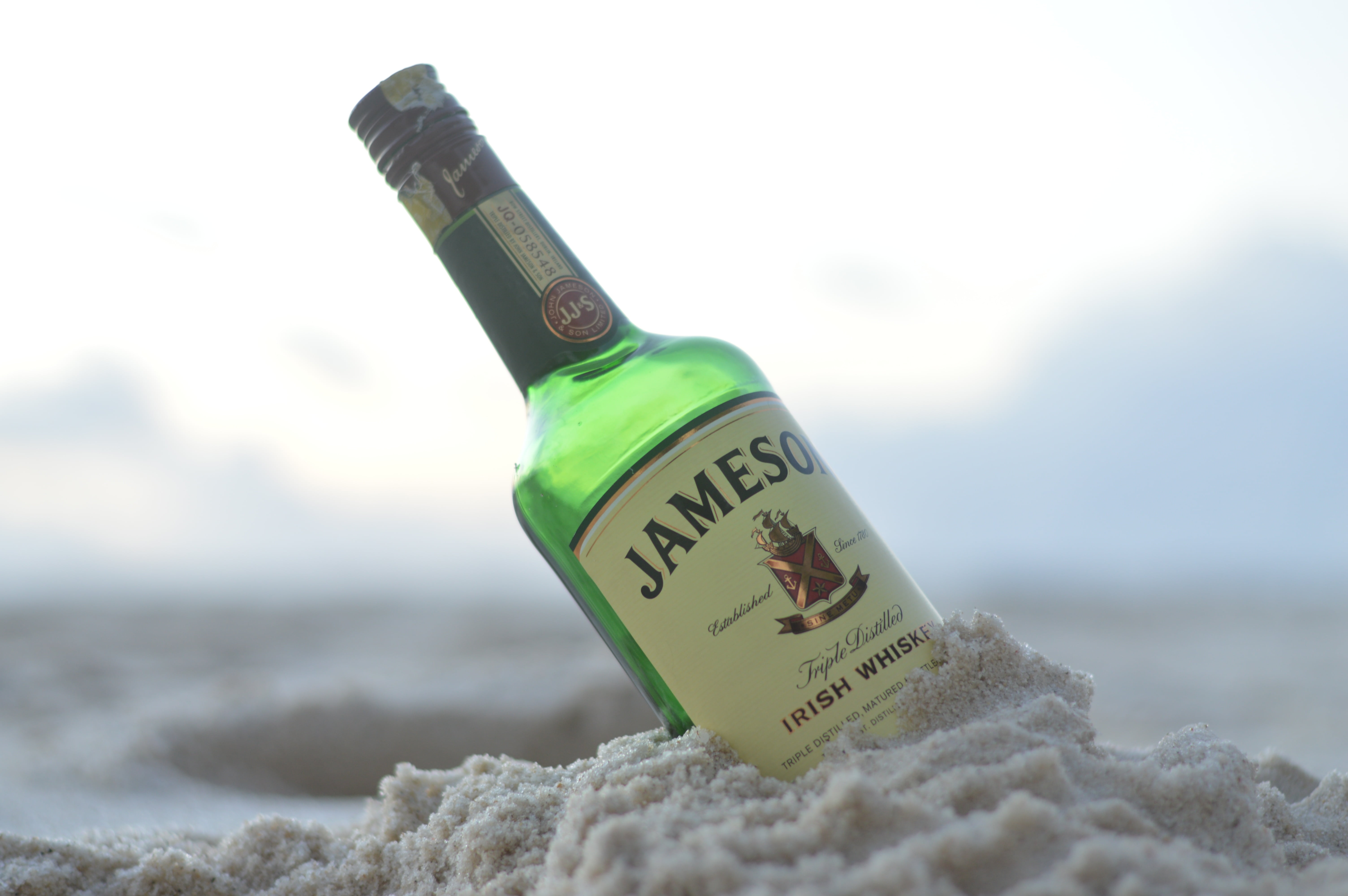 container, water, drink, bottle, food and drink, kenya, message, land, western script, refreshment, jameson, close-up, beach, alcohol, 5K, sand, focus on foreground, HD Wallpaper