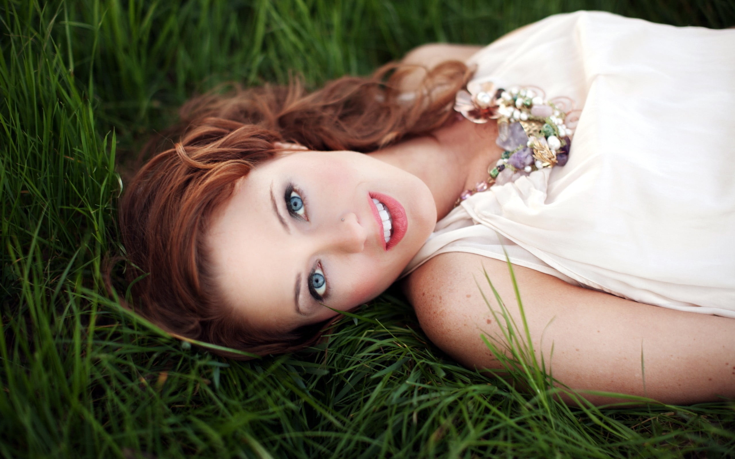 beautiful woman, looking at camera, grass, adult, white clothing, 2K, open mouth, face, portrait, women, pierced nose, lying down, depth of field, beauty, HD Wallpaper