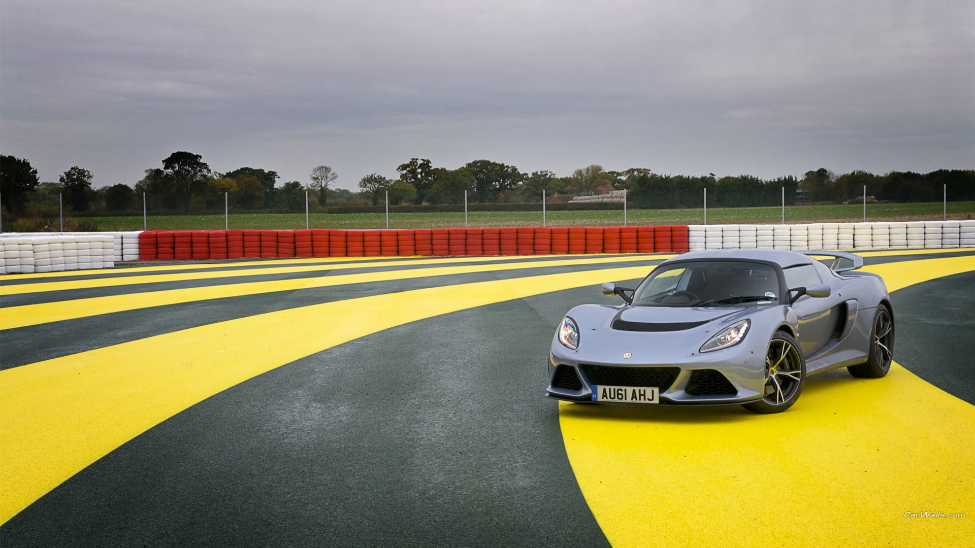 sports track, Lotus, motor racing track, auto racing, outdoors, sport, motor vehicle, no people, racecar, mode of transportation, road, yellow, competition, HD Wallpaper