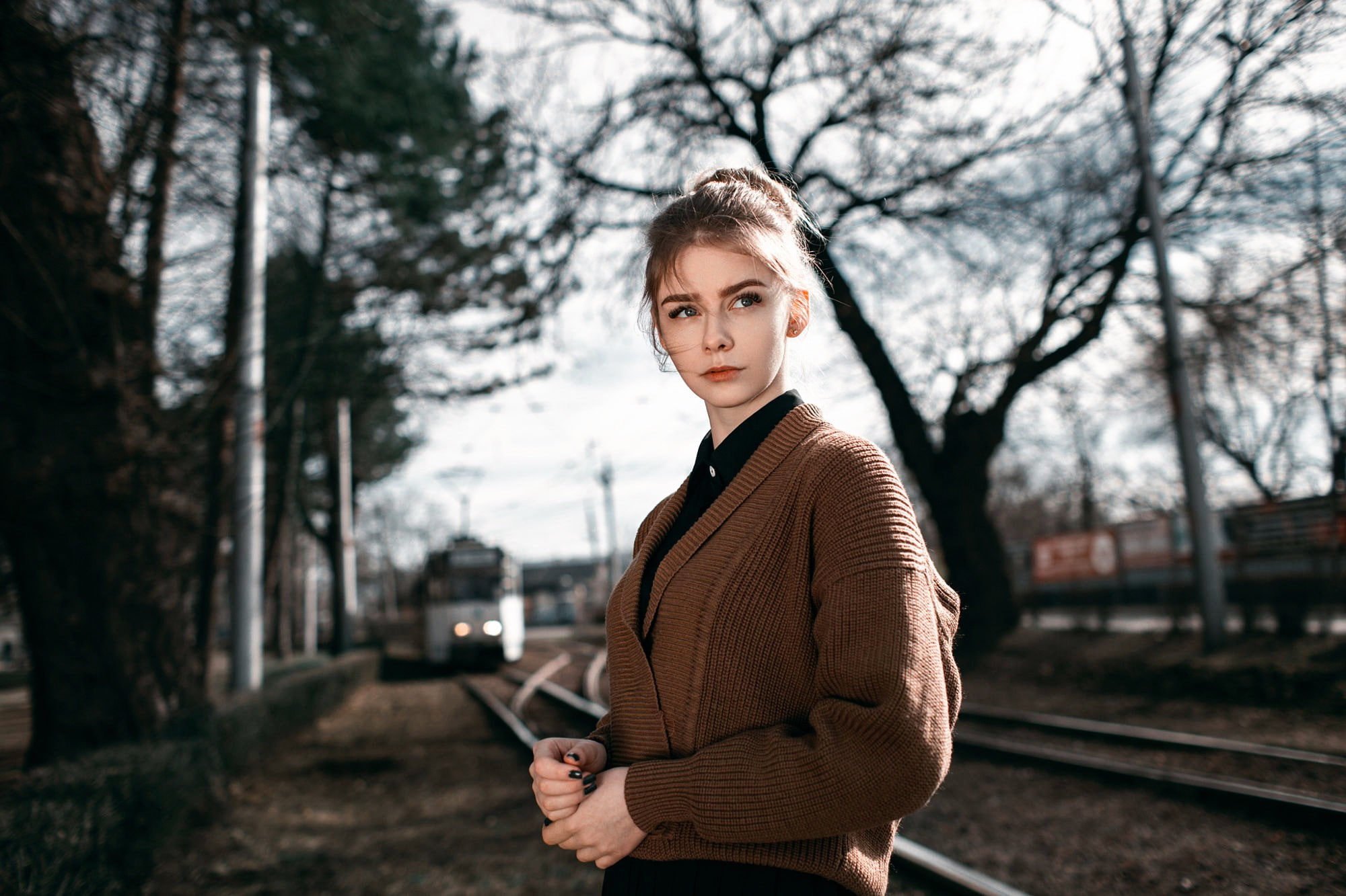 hairstyle, standing, 1080P, women, real people, railroad track, clothing, urban, beautiful woman, looking at camera, focus on foreground, young women, HD Wallpaper
