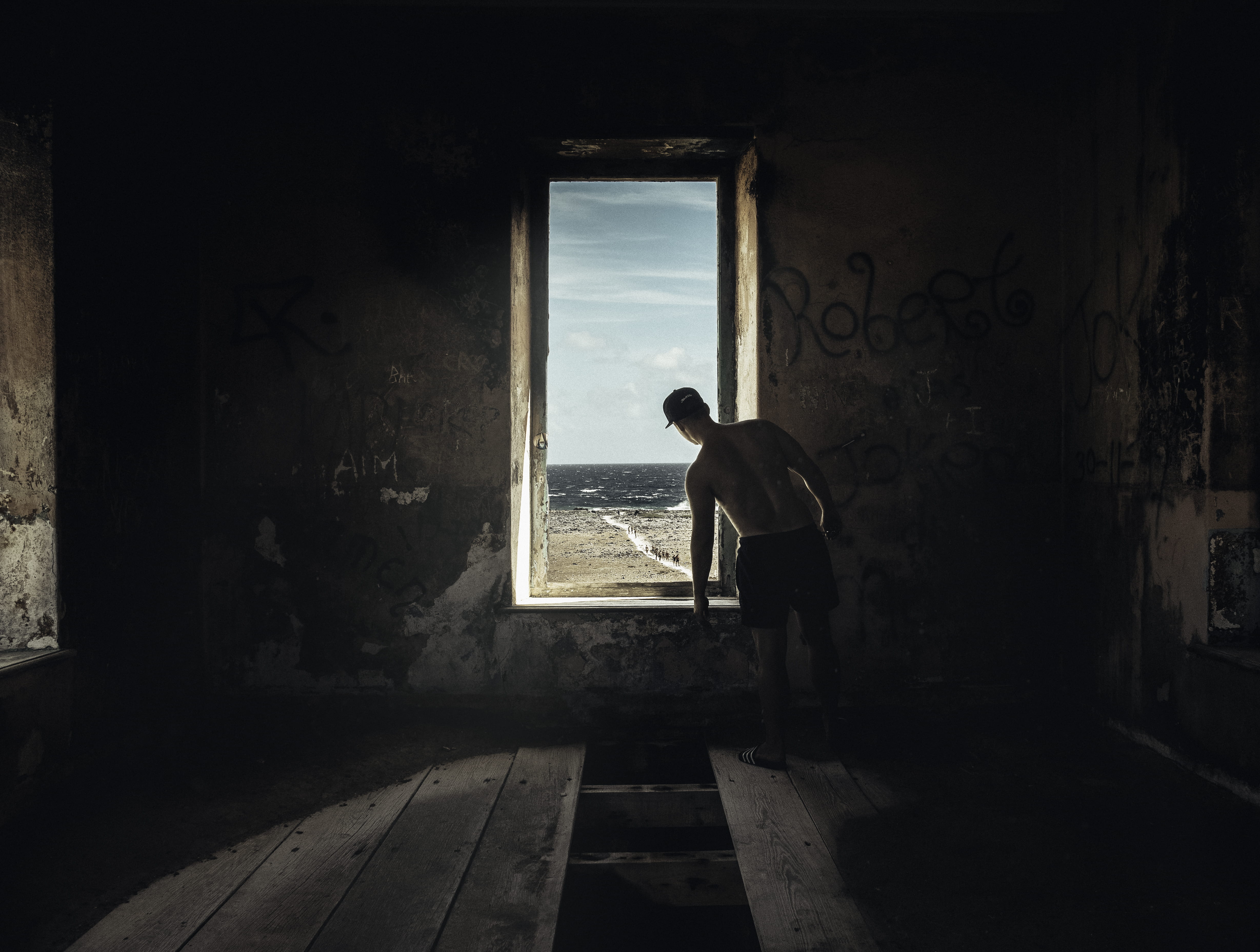 day, person, sunlight, men, standing, full length, horizontal, deterioration, trouble, cap, nature, dark, sea, indoors, abandoned, wooden floor, urban, HD Wallpaper