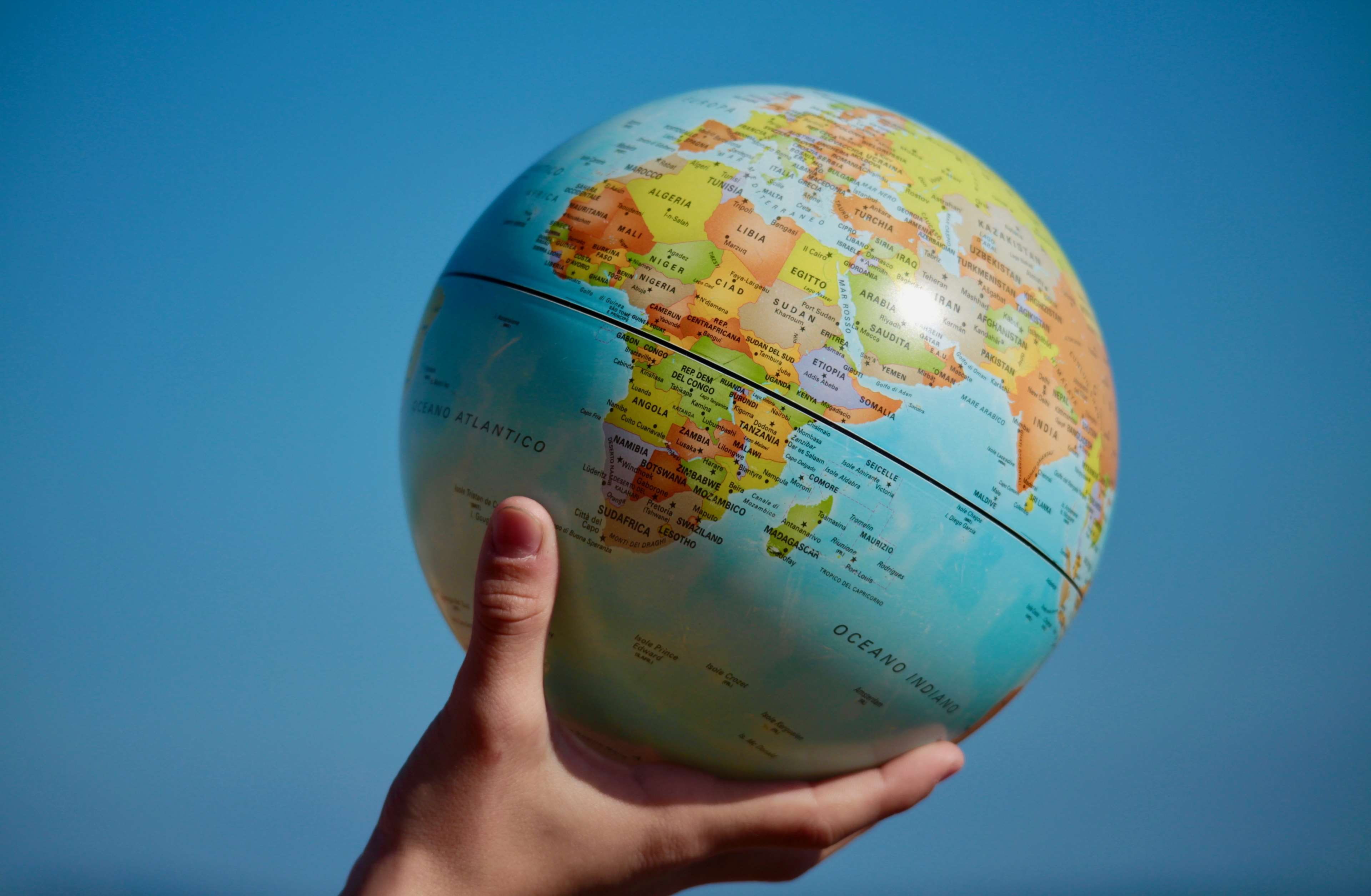 hands, globe - man made object, blue background, human body part, children, world map, body part, colors, studio shot, earth, family, future, continents, HD Wallpaper