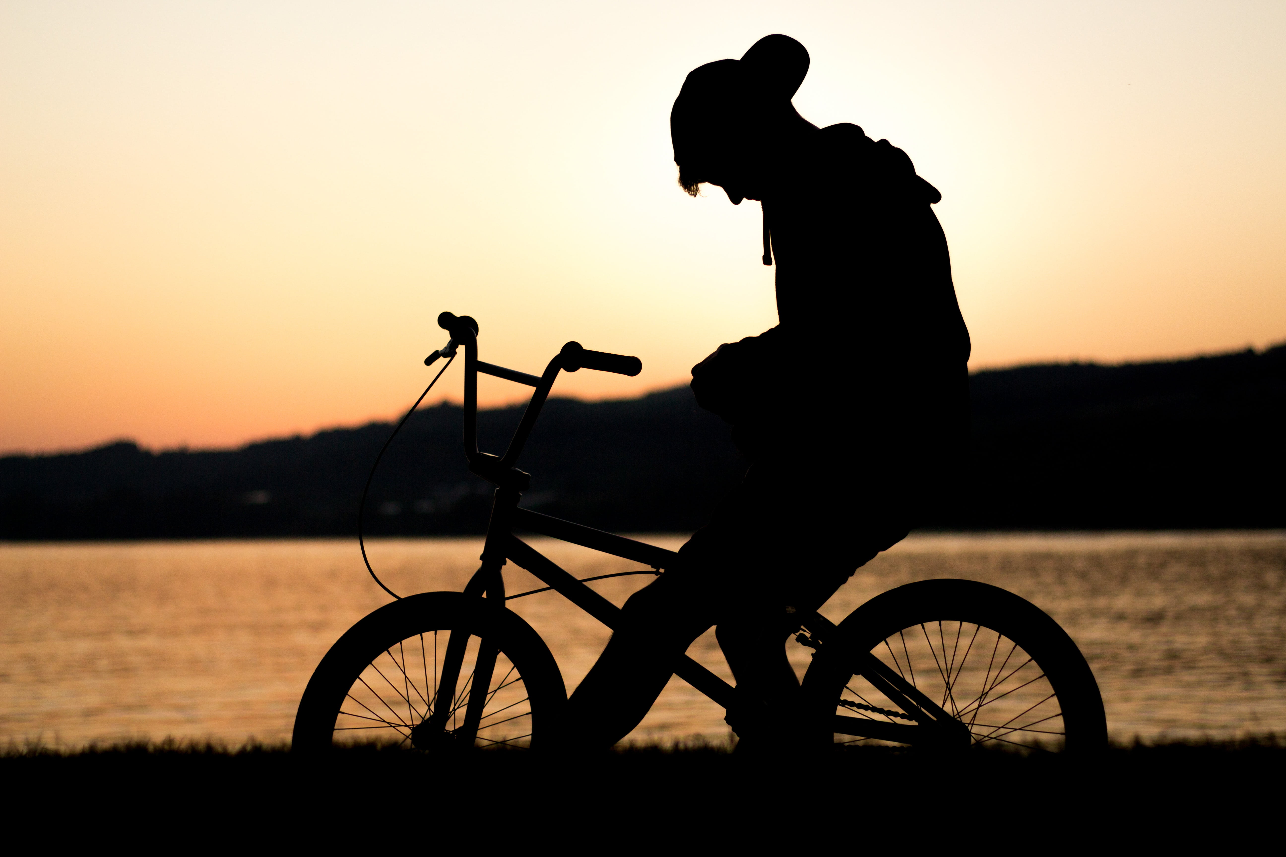 lonely, sun, sunrise, full length, looking down, dawn, riding, biker, leisure activity, person, sport, backlit, silhouette, sea, ocean, sitting, nature, HD Wallpaper