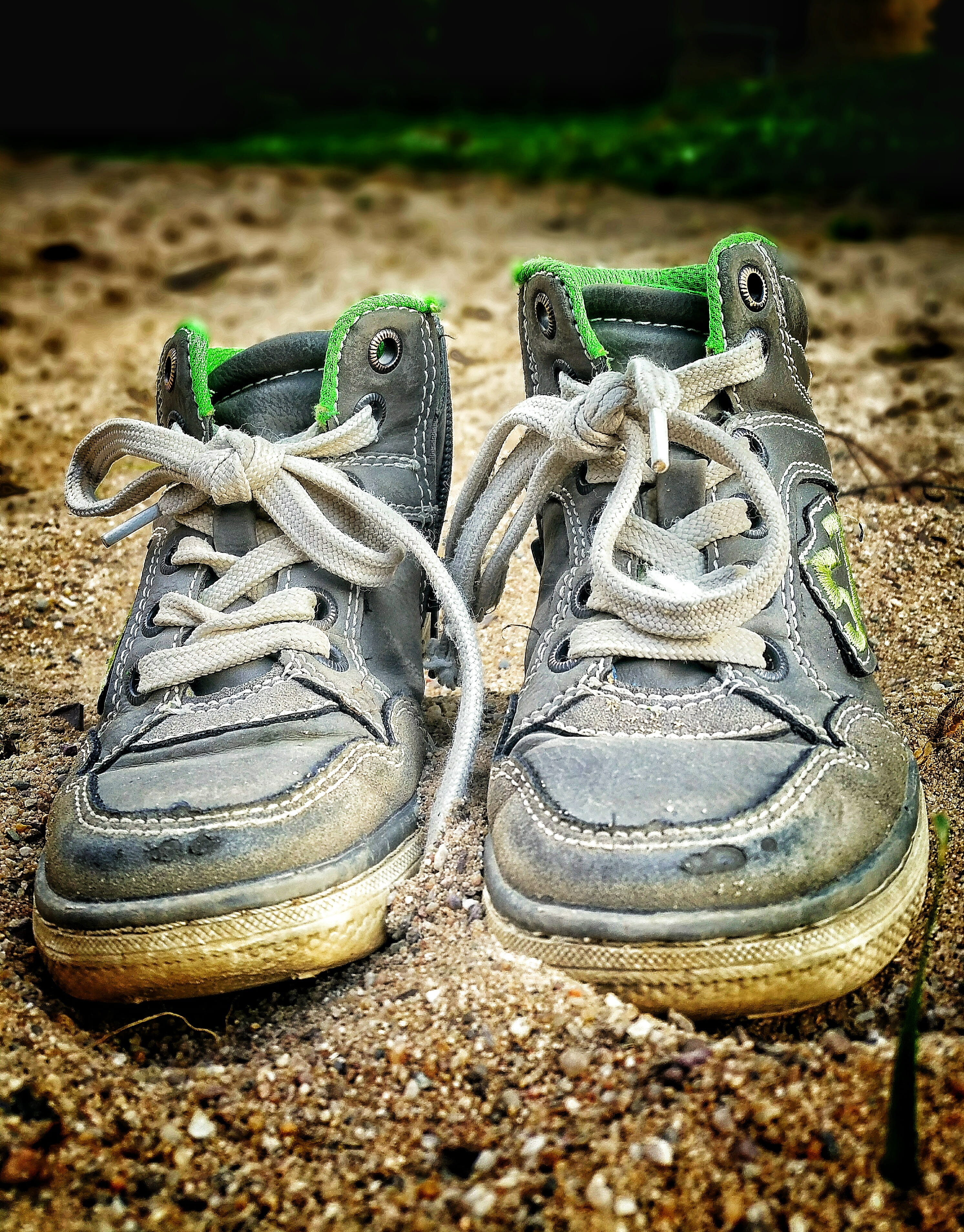 focus on foreground, pebble, sports Shoe, adrift, two objects, field, Holiday, close-up, high angle view, group of animals, Sand, green, Shoes, dirt, 2K, Phone HD Wallpaper