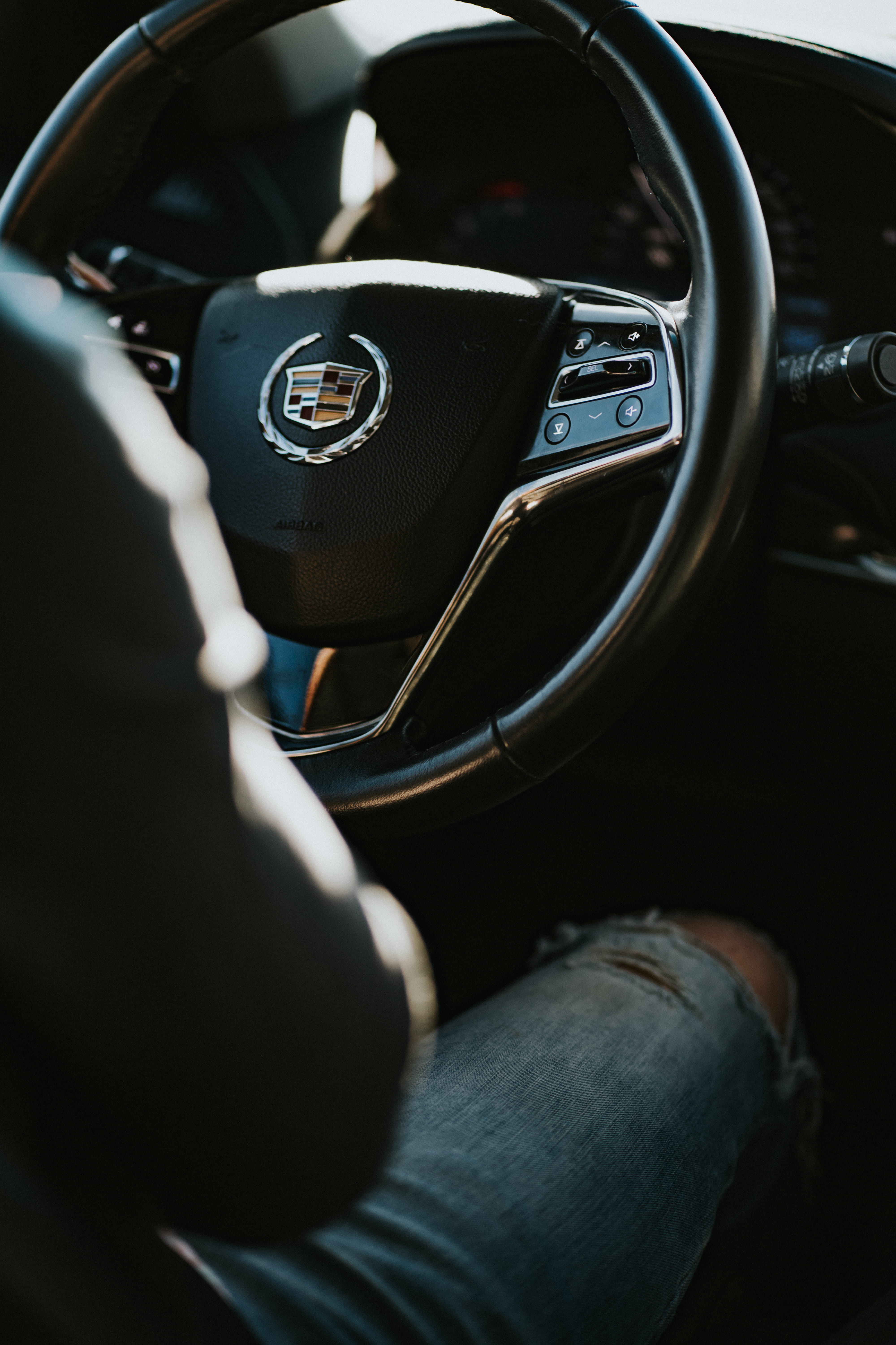 symbol, distressed, clothing, denim, hand, gauge, cadillac, gearshift, human leg, car interior, vehicle interior, crowd, road trip, steering wheel, human body part, Phone HD Wallpaper