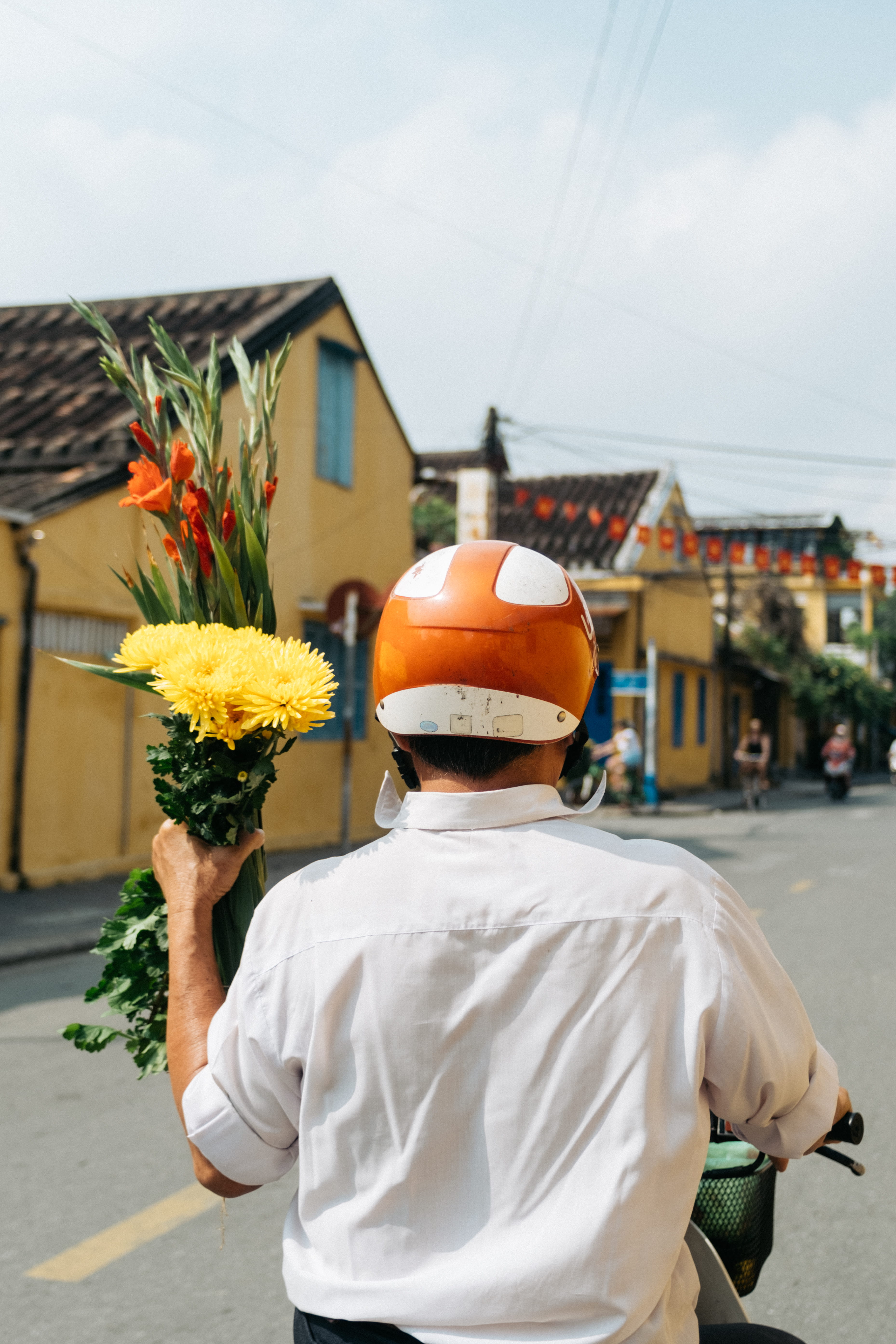 human, sunflower, motorcycle, plant, flower arrangement, one person, city, bouquet, tet, yellow, architecture, real people, hardhat, daytime, 5K, lifestyles, Phone HD Wallpaper