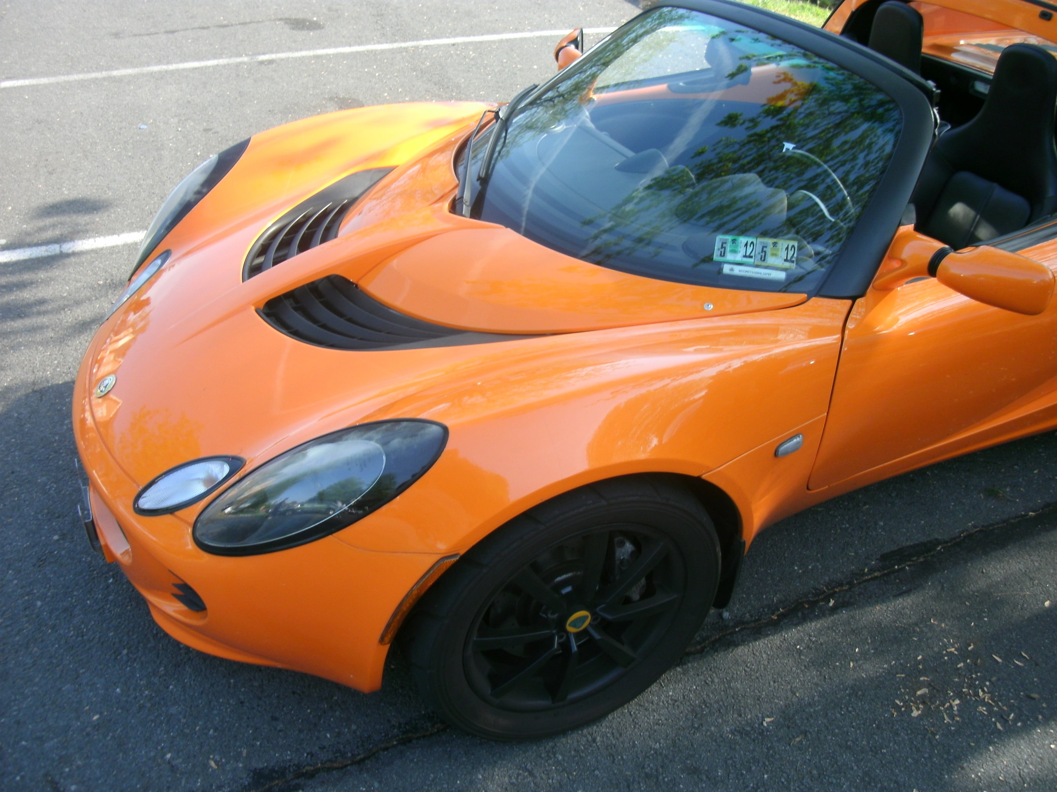 lotus, stationary, transportation, speed, yellow, day, sports Car, parking, convertible, power, city, automobile, travel, orange color, orange, no people, HD Wallpaper