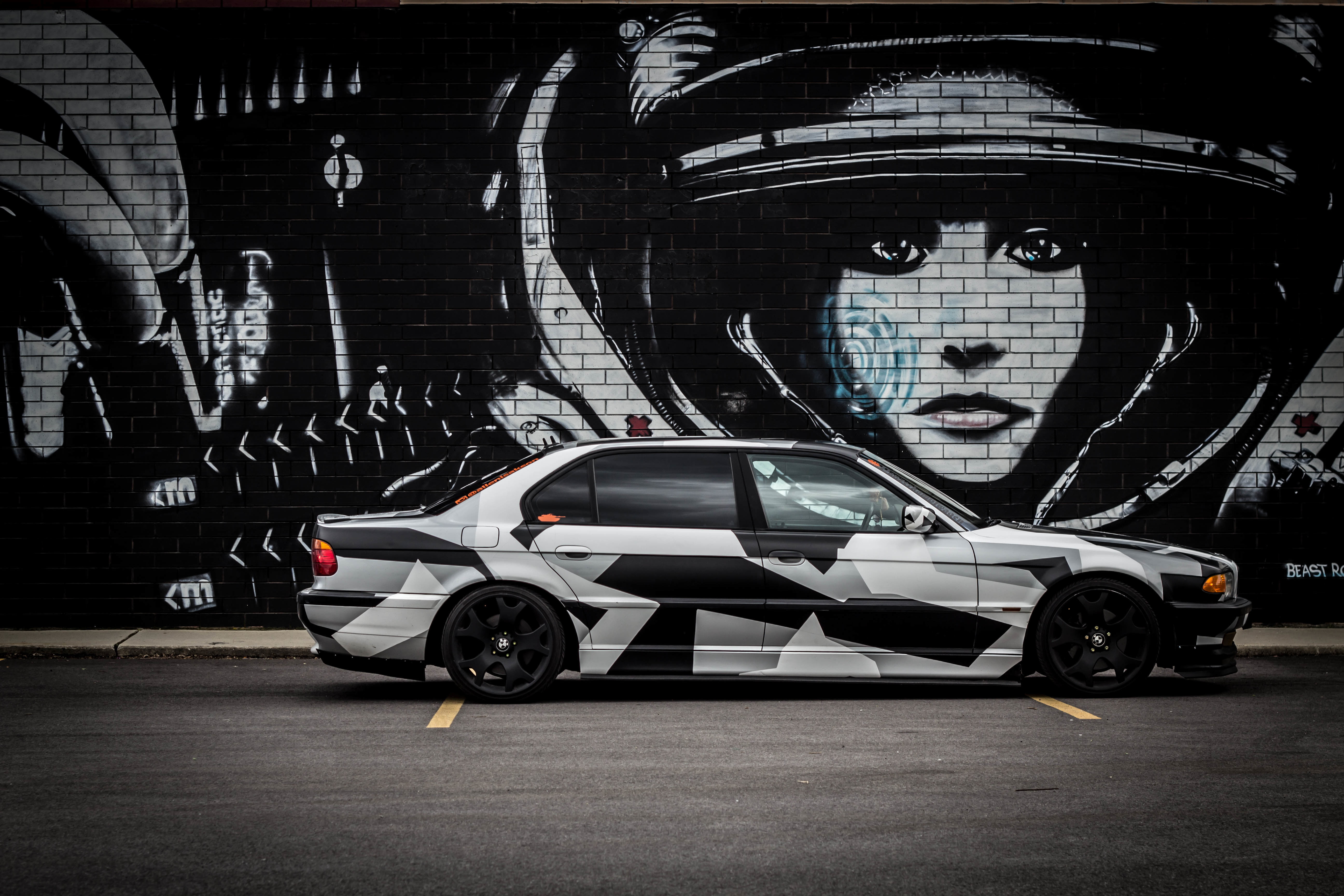 land vehicle, building exterior, BMW, white, road, arctic camo, representation, car, human representation, outdoors, sedan, built structure, motor vehicle, HD Wallpaper