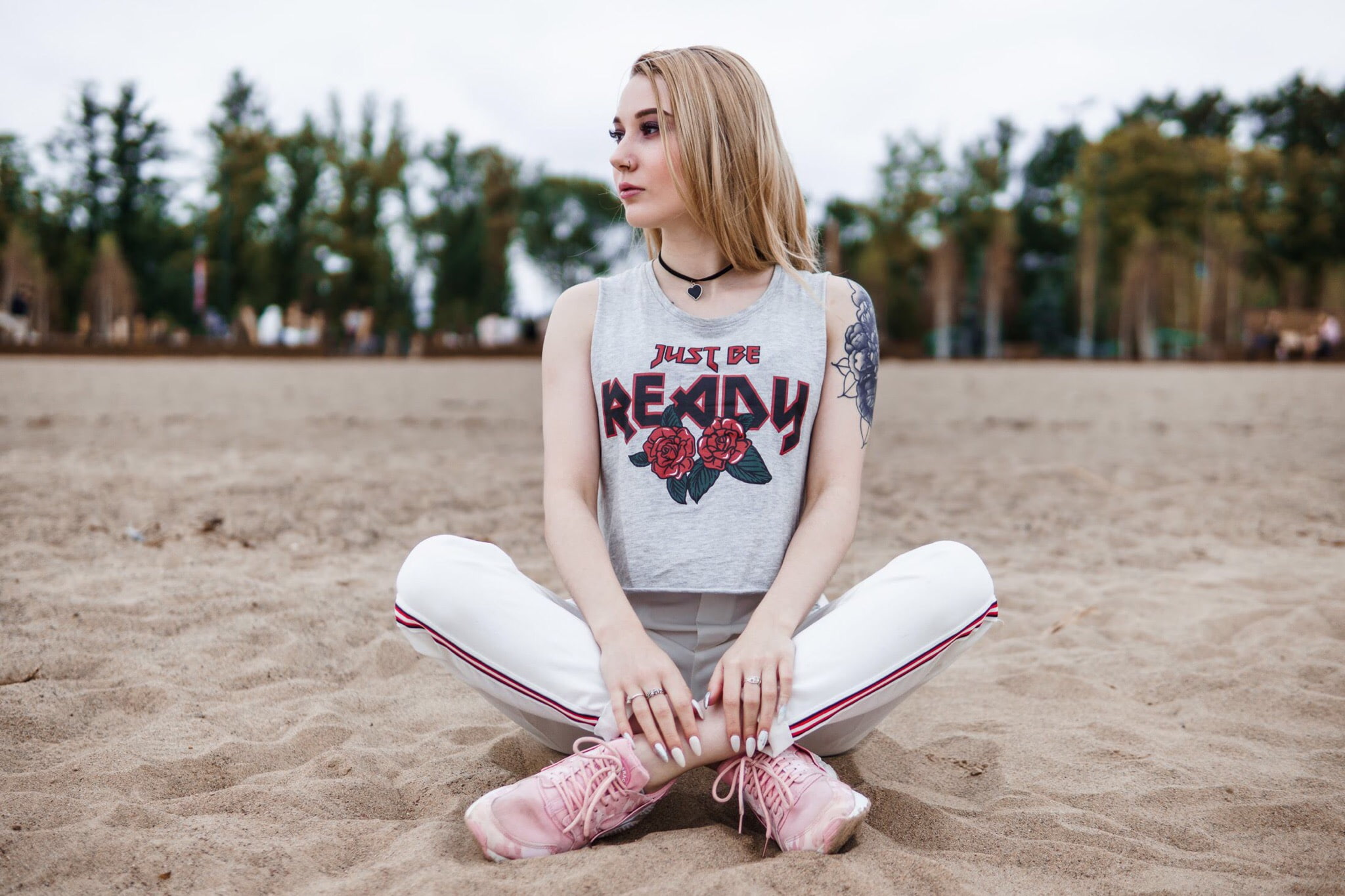 nose rings, women, model, blonde, crop top, sitting, women outdoors, necklace, depth of field, sneakers, pants, typography, Iron Maiden, tattoo, 1080P, HD Wallpaper
