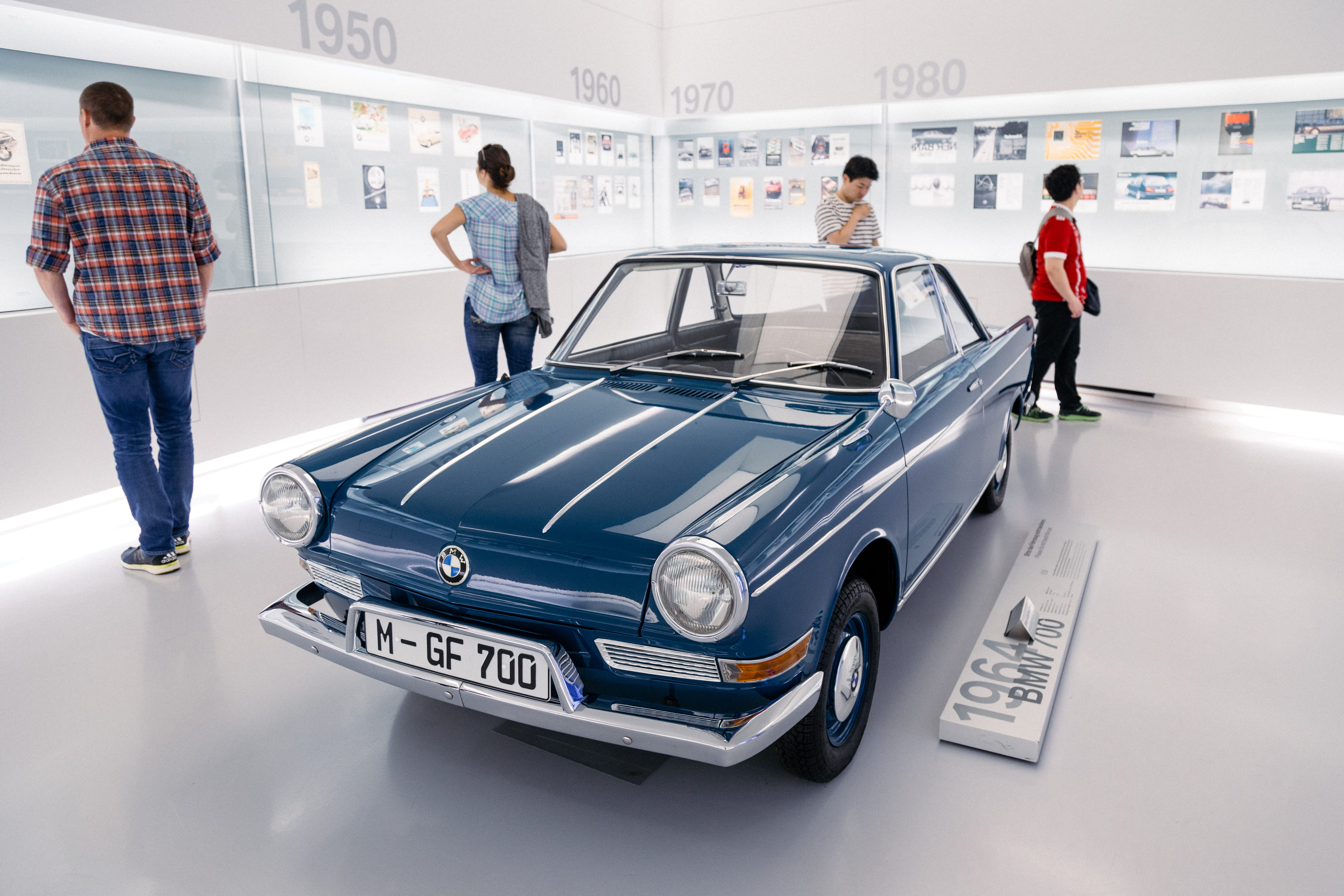 adult, coupe, car museum, sports car, motor vehicle, standing, men, car, tartan, paper, human, group of people, casual clothing, automobile, plaid, classic car, HD Wallpaper