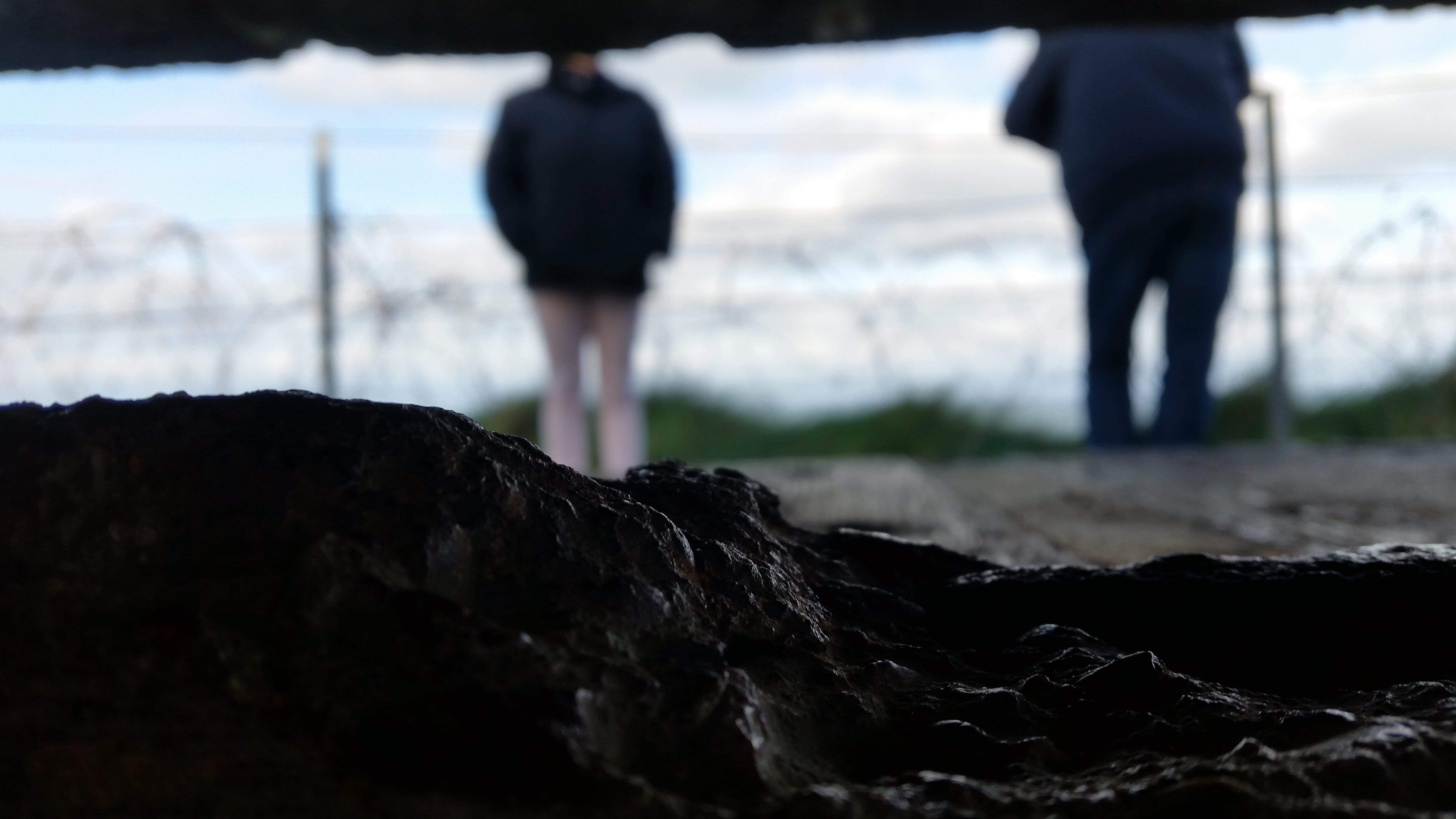 solid, unrecognizable person, environment, stone, day, land, blurred shot, men, rock, nature, standing, rear view, france, focus on foreground, saint-laurent-sur-mer, HD Wallpaper