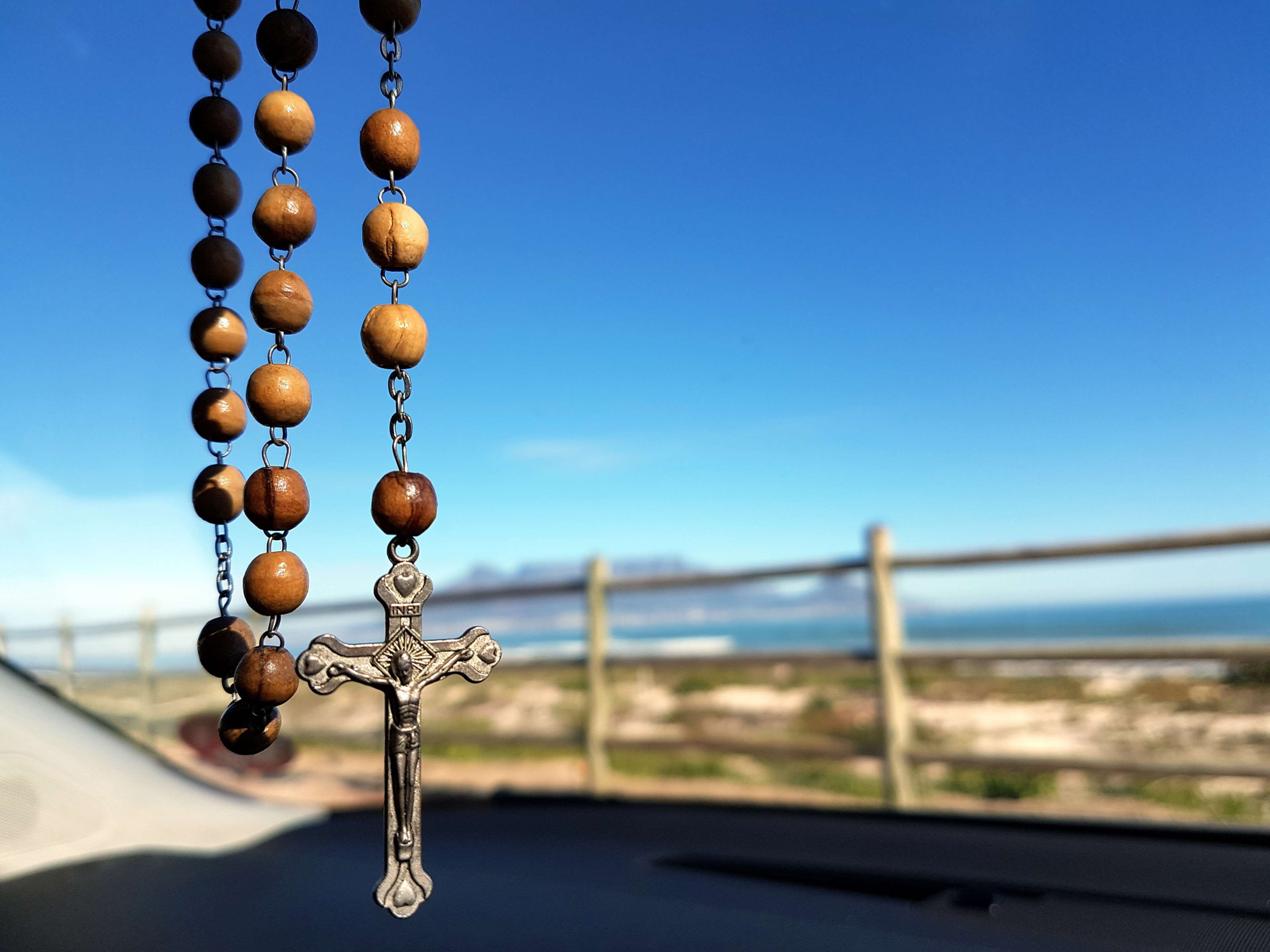 clear sky, religious, blur, hanging, close-up, christianity, crucifix, no people, catholicism, outdoors, 4K, focus on foreground, symbol, spiritual, beads, HD Wallpaper