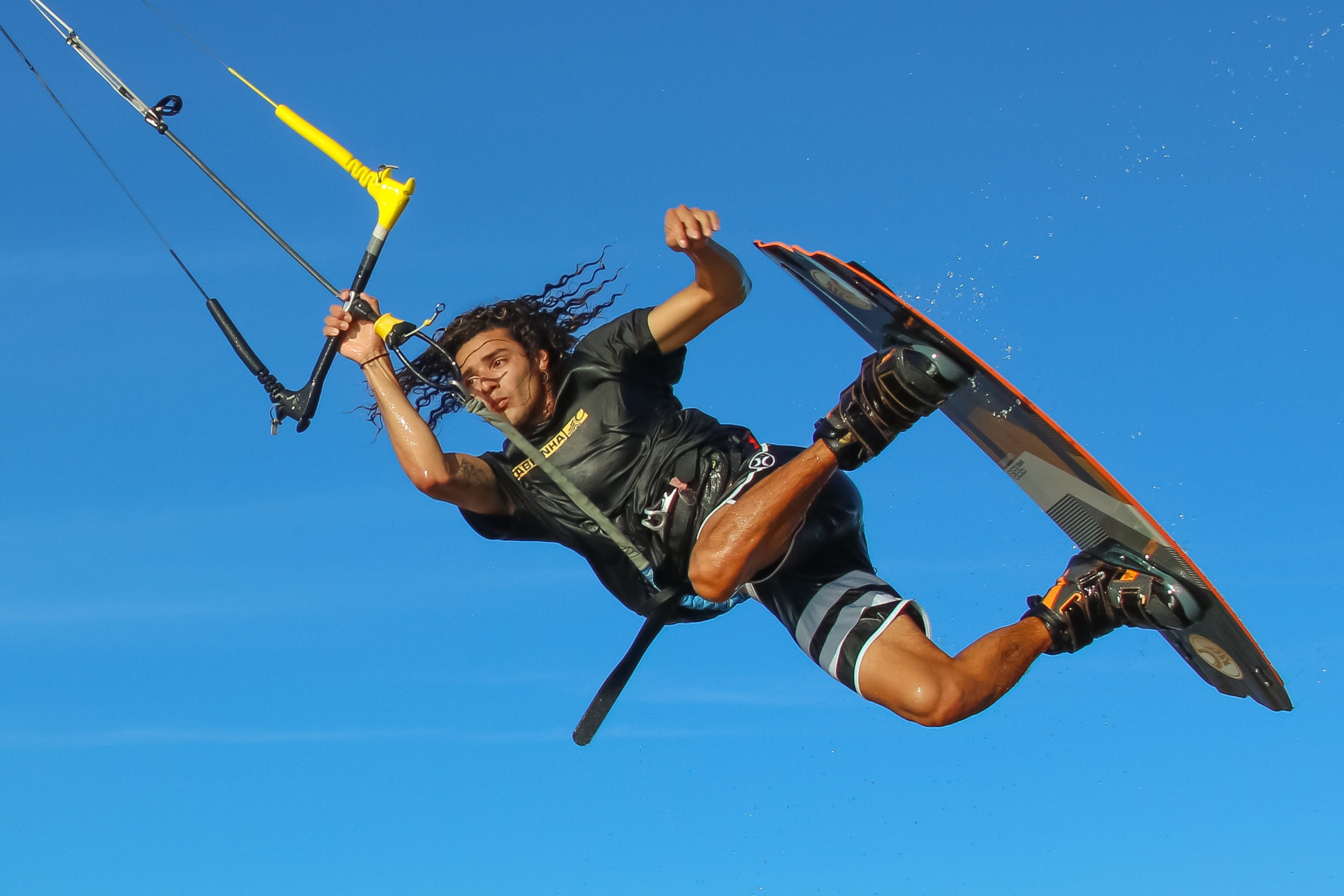 nature, casual clothing, kitesurfer, mid-air, jumping, motion, low angle view, wind, one person, 2K, kiteboard, kiteboarding, kitesurf, human arm, young adult, HD Wallpaper