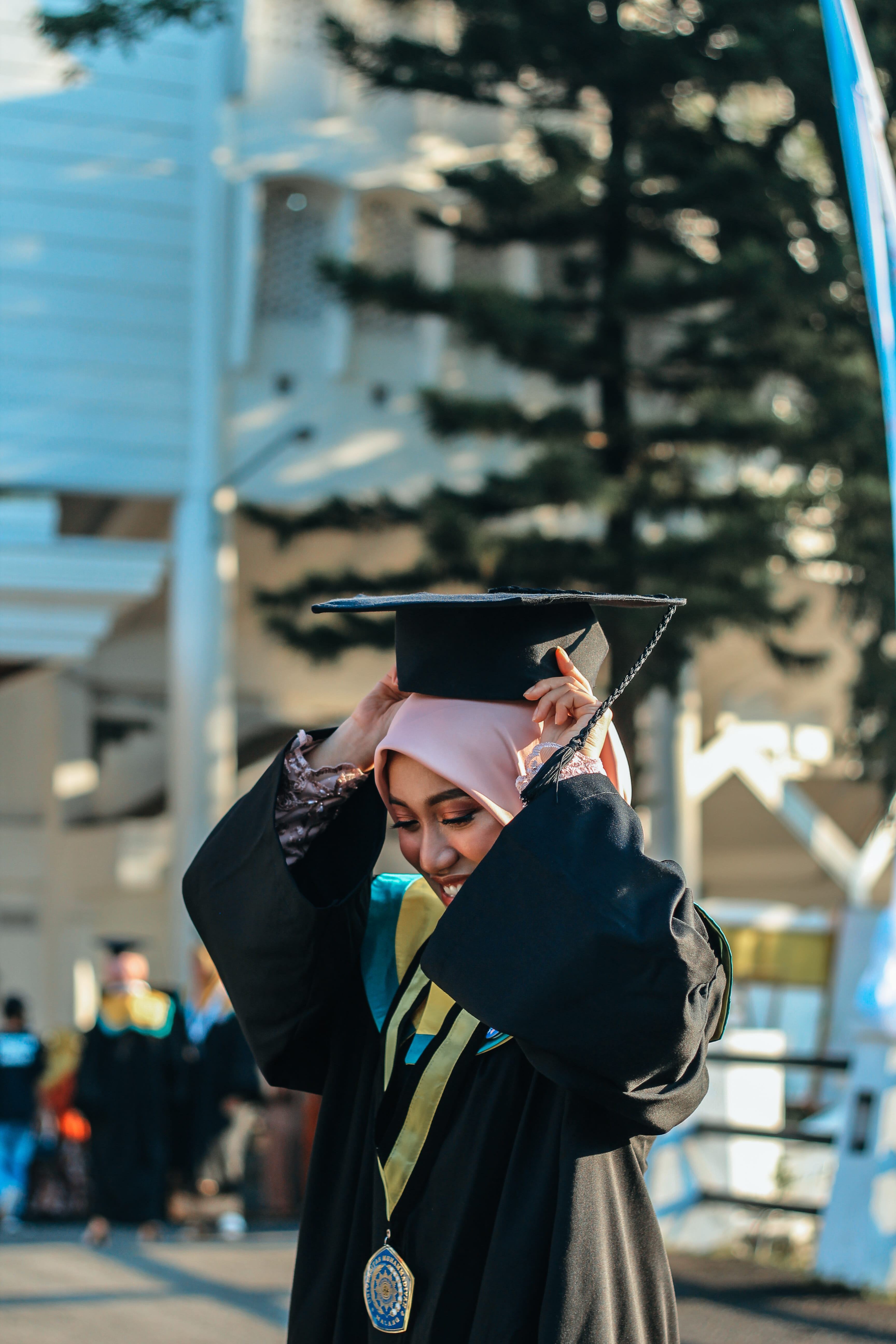 happiness, wearing, mortarboard, one person, outdoors, student, built structure, university, day, focus on foreground, mortar, real people, waist up, graduation gown, Phone HD Wallpaper