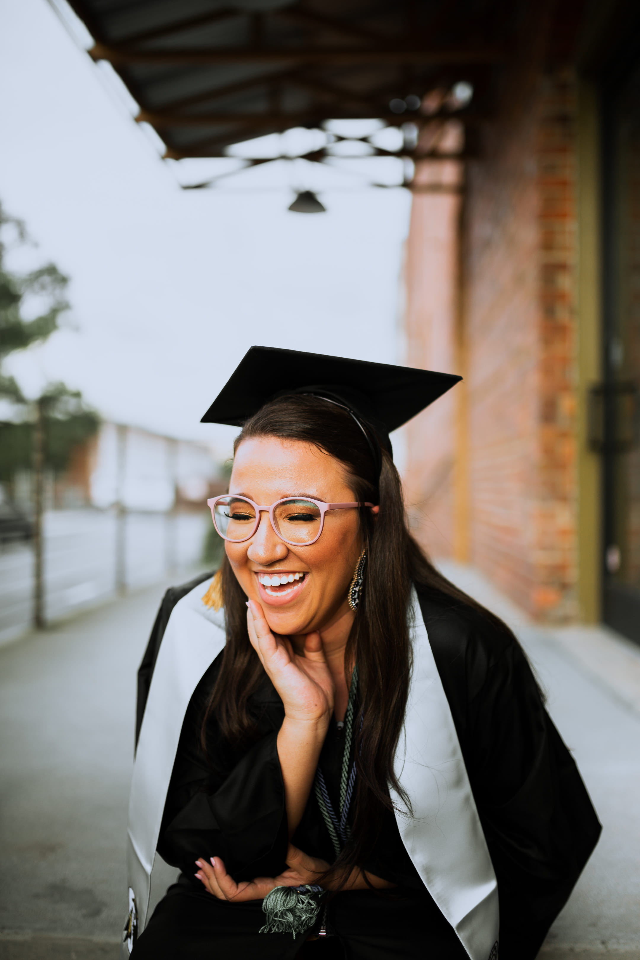 finger, clothing, portrait, lifestyles, 2K, young adult, accessories, architecture, coat, graduation, graduation gown, happiness, outdoors, one person, Phone HD Wallpaper