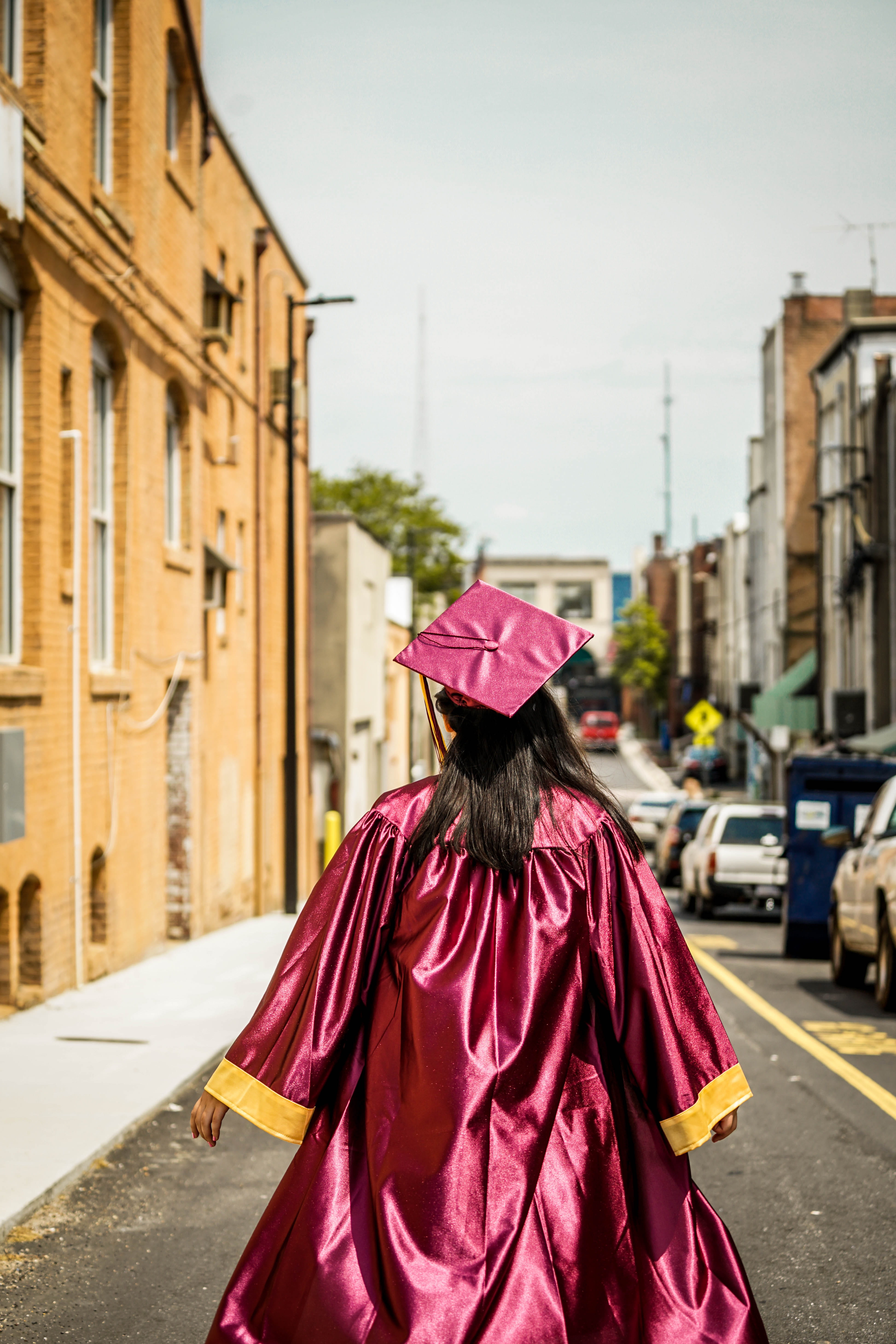 one person, road, adult, mortarboard, woman, walking, clothing, day, women, city, rear view, building exterior, built structure, focus on foreground, street, Phone HD Wallpaper