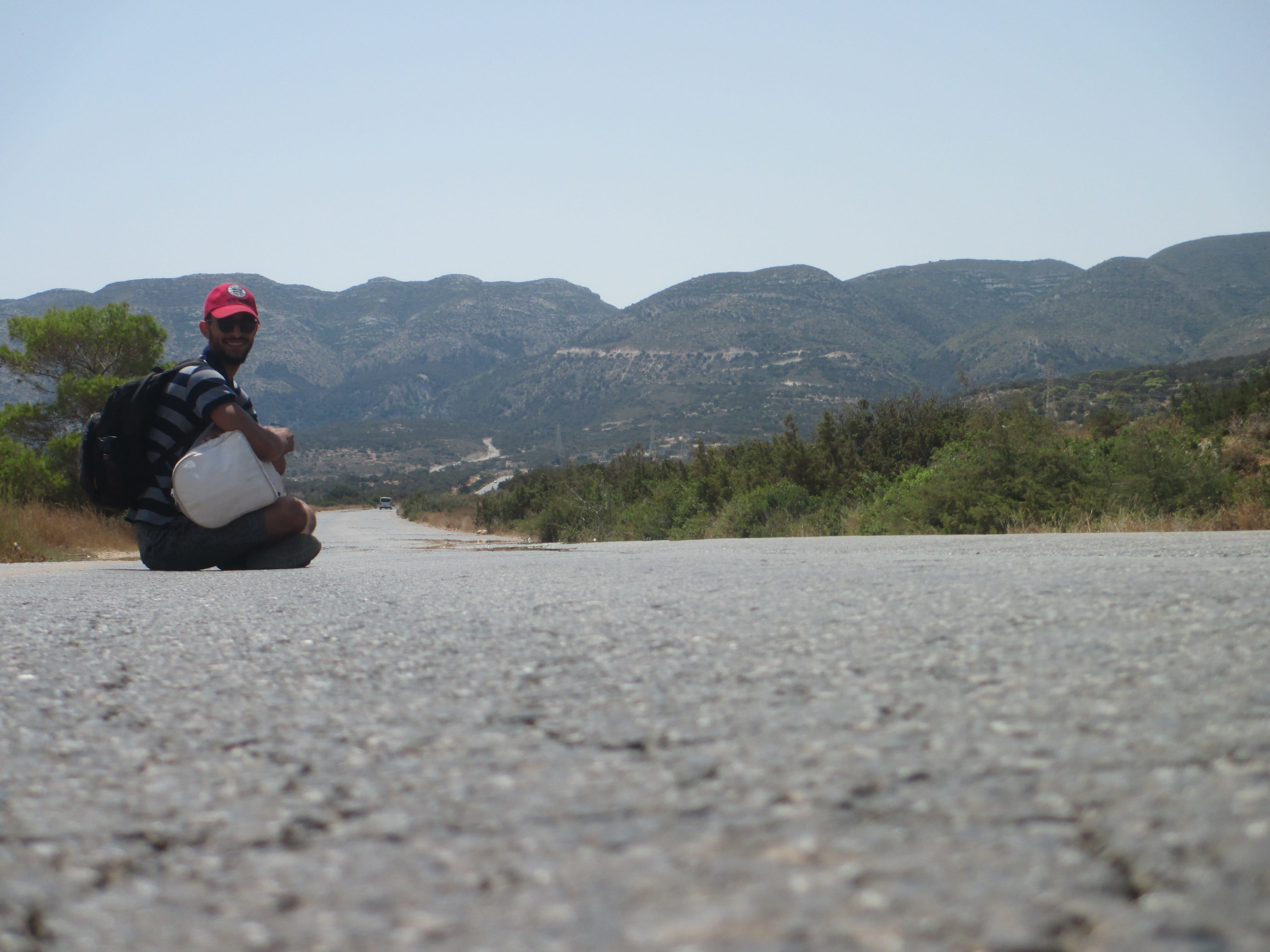 clear sky, apparel, real people, mountain, person, casual clothing, road, day, helmet, 4K, hat, men, sky, gravel, libya, travel, ras-alhalal, clothing, HD Wallpaper