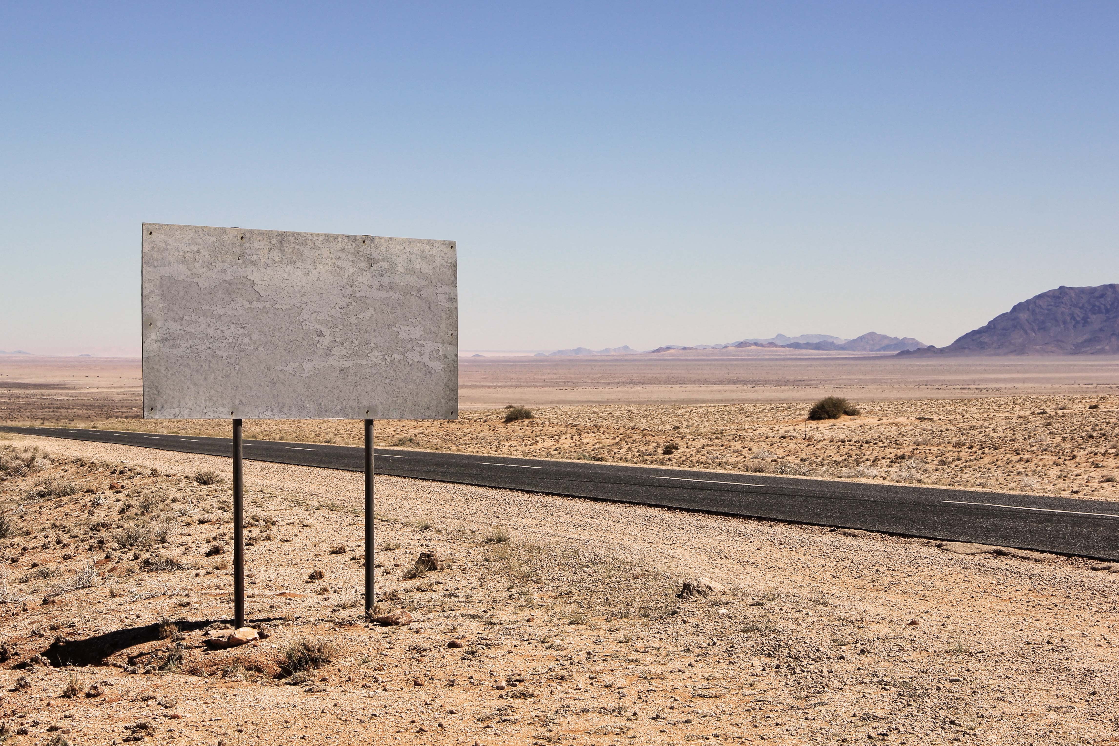 desert, no people, information boards, tranquility, semi-arid, sign, arid Climate, tranquil scene, carriageway, direction, sky, dry, note, clear sky, non-urban scene, HD Wallpaper