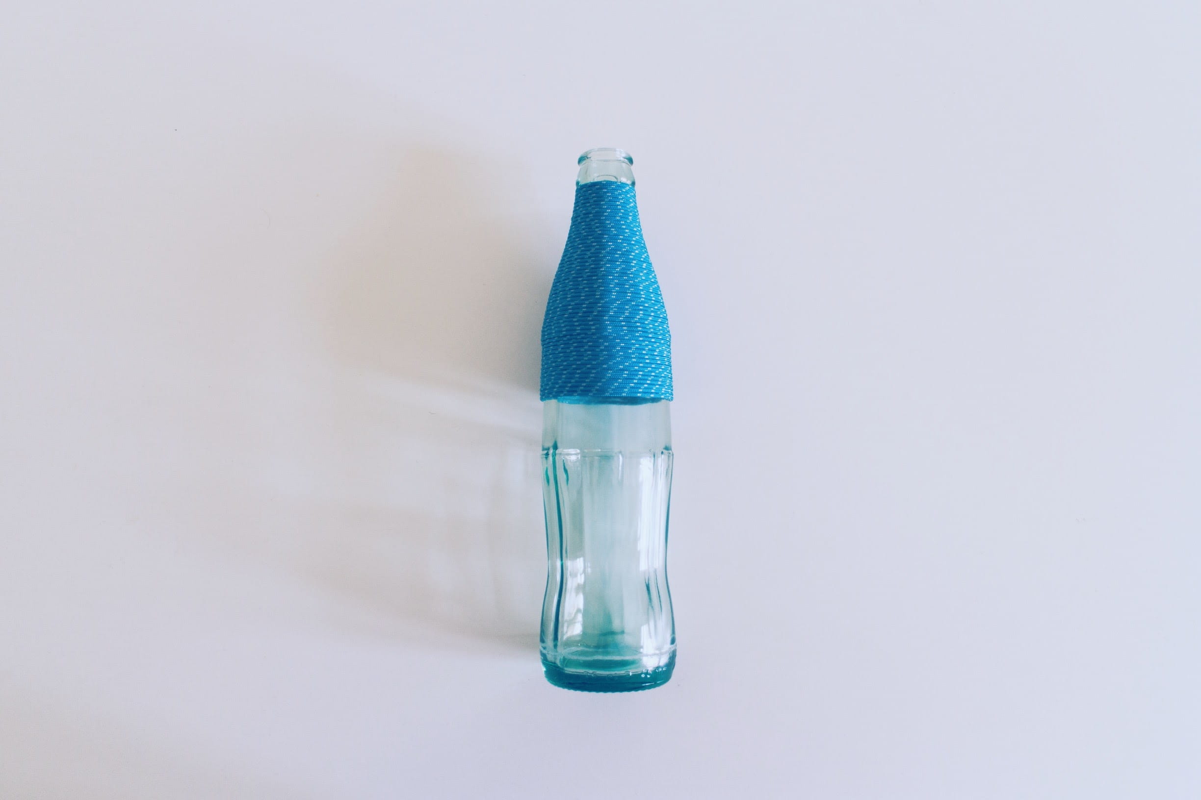 cocacola, 1080P, nil, green color, no people, coke, studio shot, rope, bottle, still life, simplicity, blue, copy space, design, glass - material, scientific experiment, HD Wallpaper