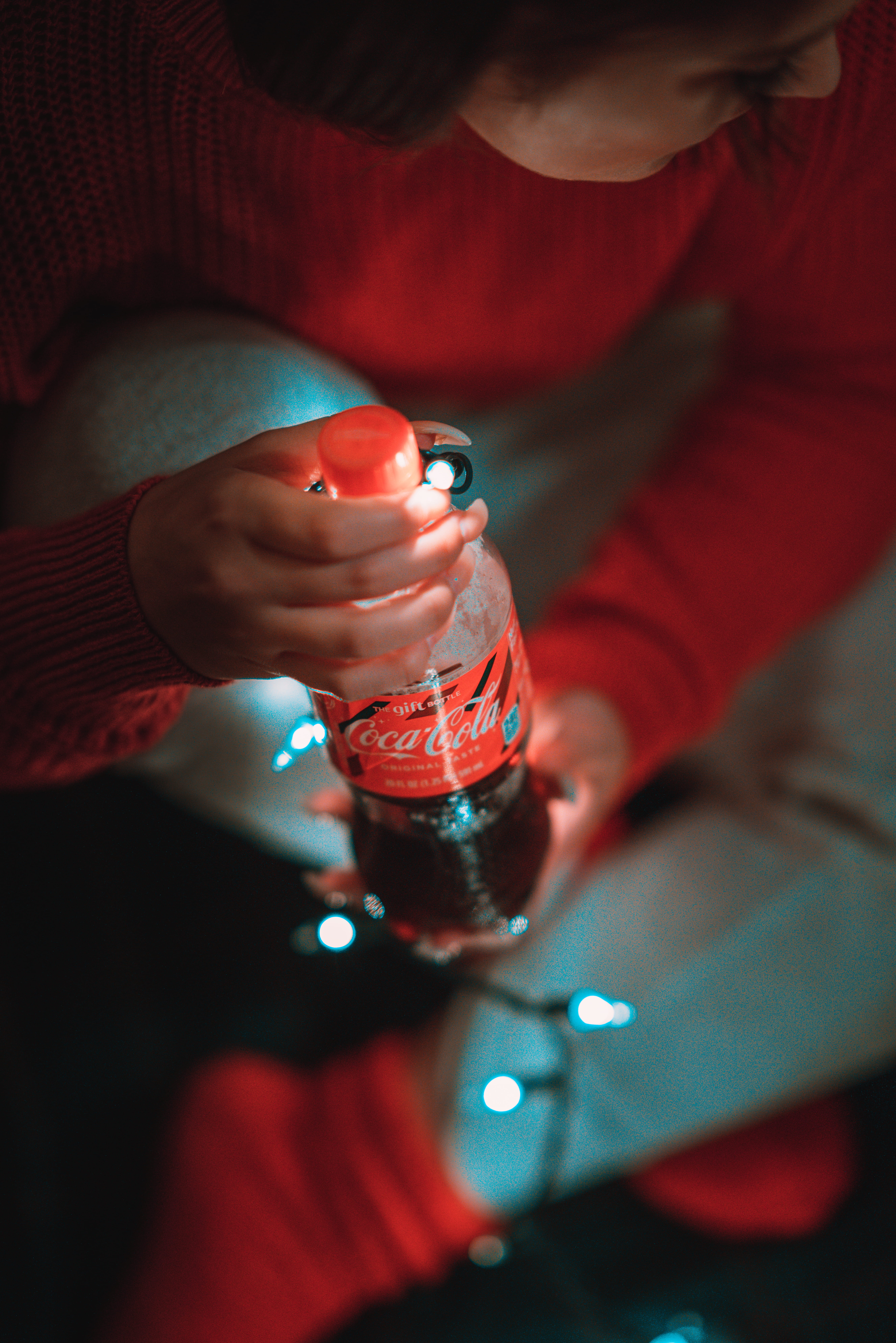 one person, cola, beverage, adult, 8K, dark, offspring, selective focus, front view, human, led, holding, drink, soda bottle, light, human hand, person, Phone HD Wallpaper
